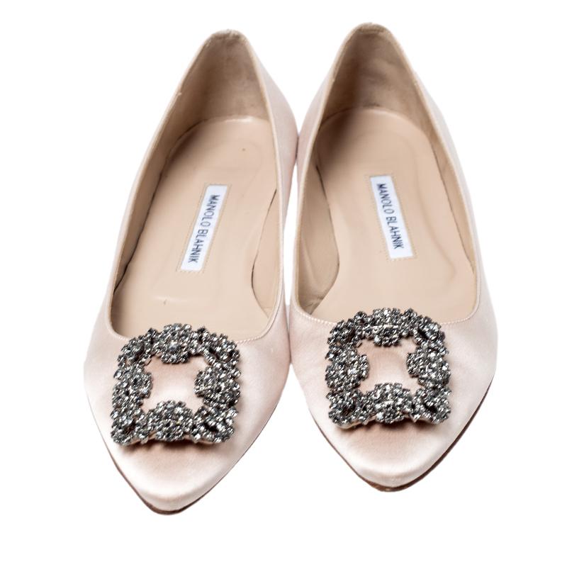 You know you are going to have a glamorous day the moment you put these ballet flats on. They are a Manolo Blahnik creation, meticulously crafted from satin and lined with leather on the insoles. The pair carries a classic beige hue and