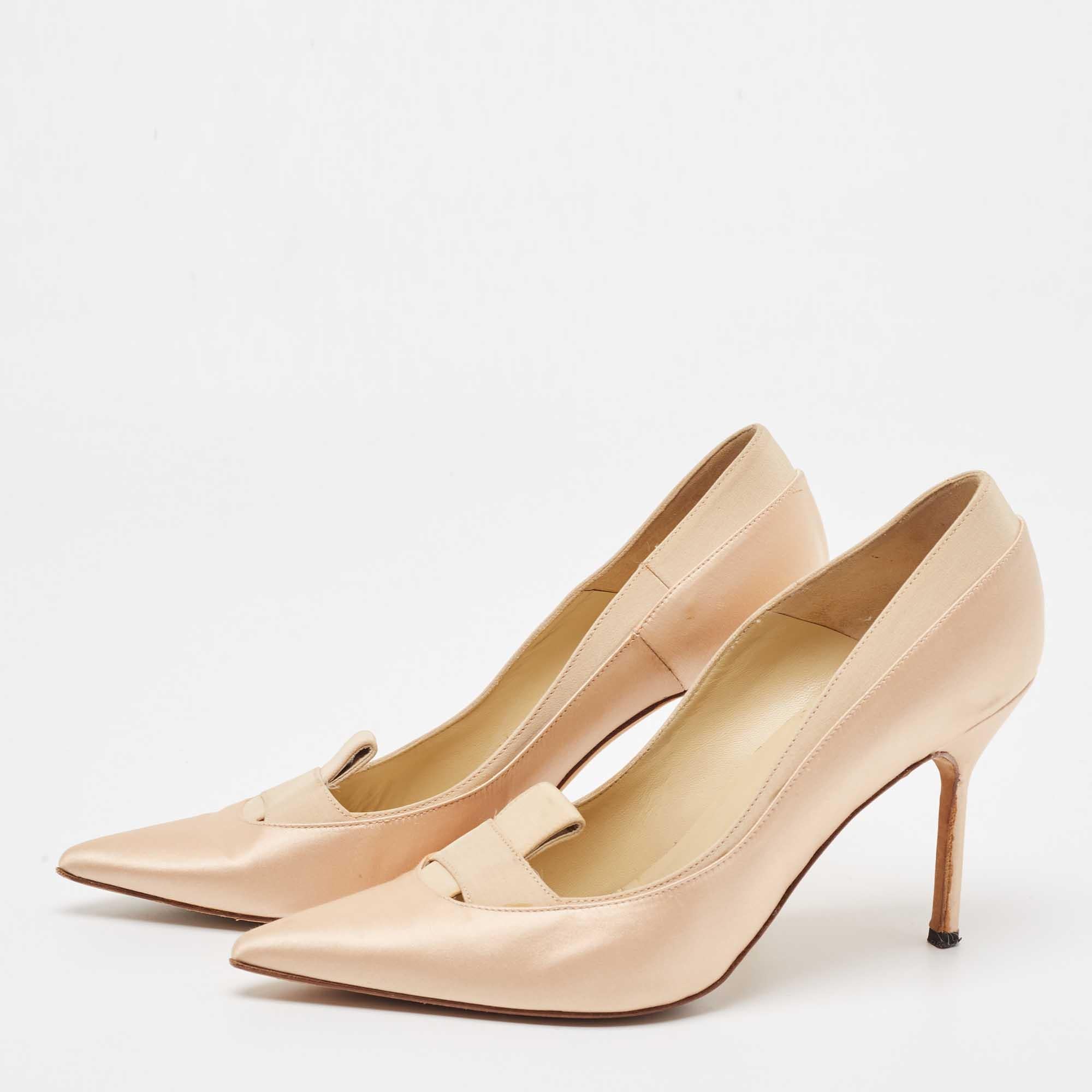 Exhibit an elegant style with this pair of pumps. These Manolo Blahnik shoes for women are crafted from quality materials. They are set on durable soles and sleek heels.