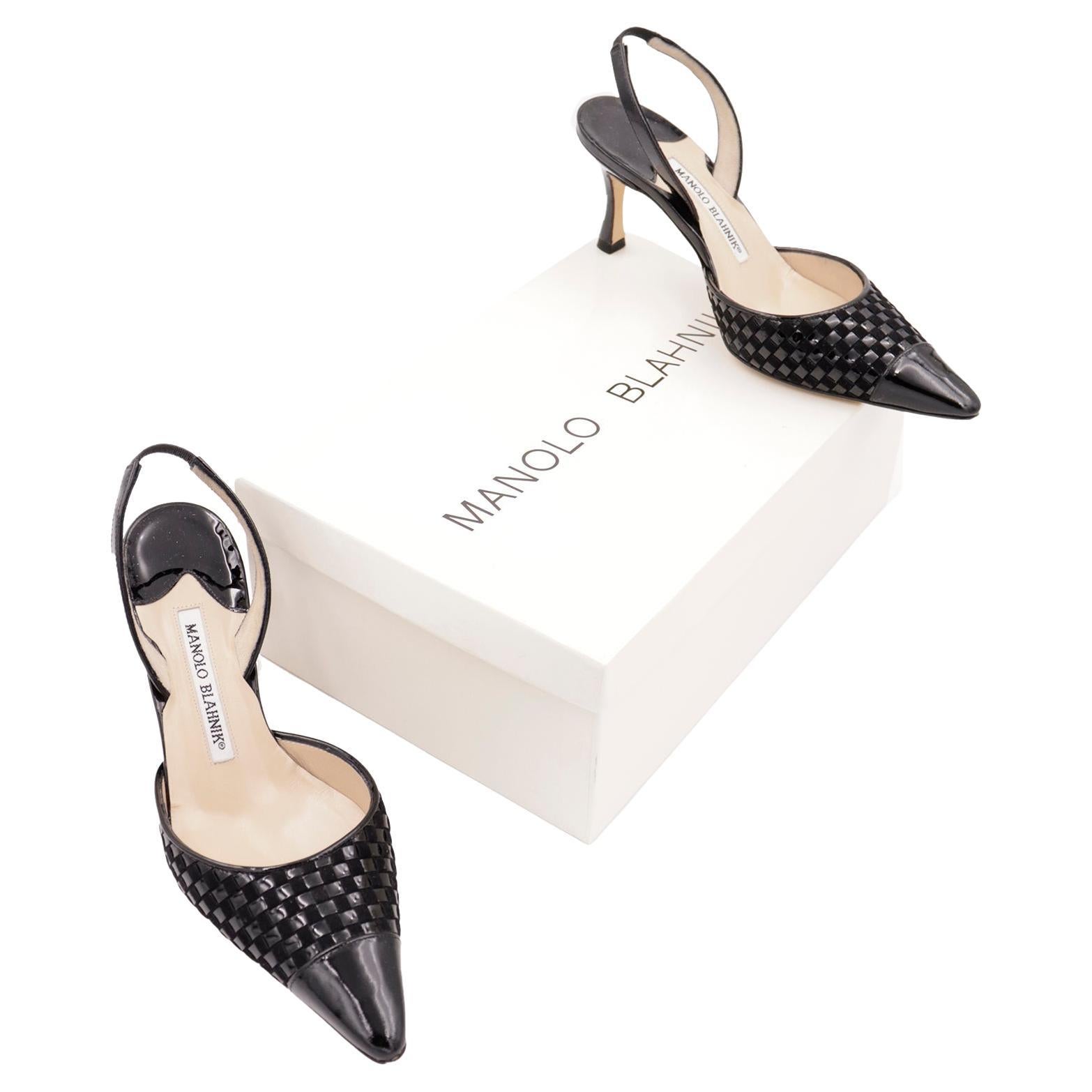 These are lovely Manolo Blahnik black leather basket weave Carolyne slingback shoes from the 2000's. These shoes come with their original box and were worn only once. We love the Blahnik Carolyne shoe and find it to be such a versatile style! These