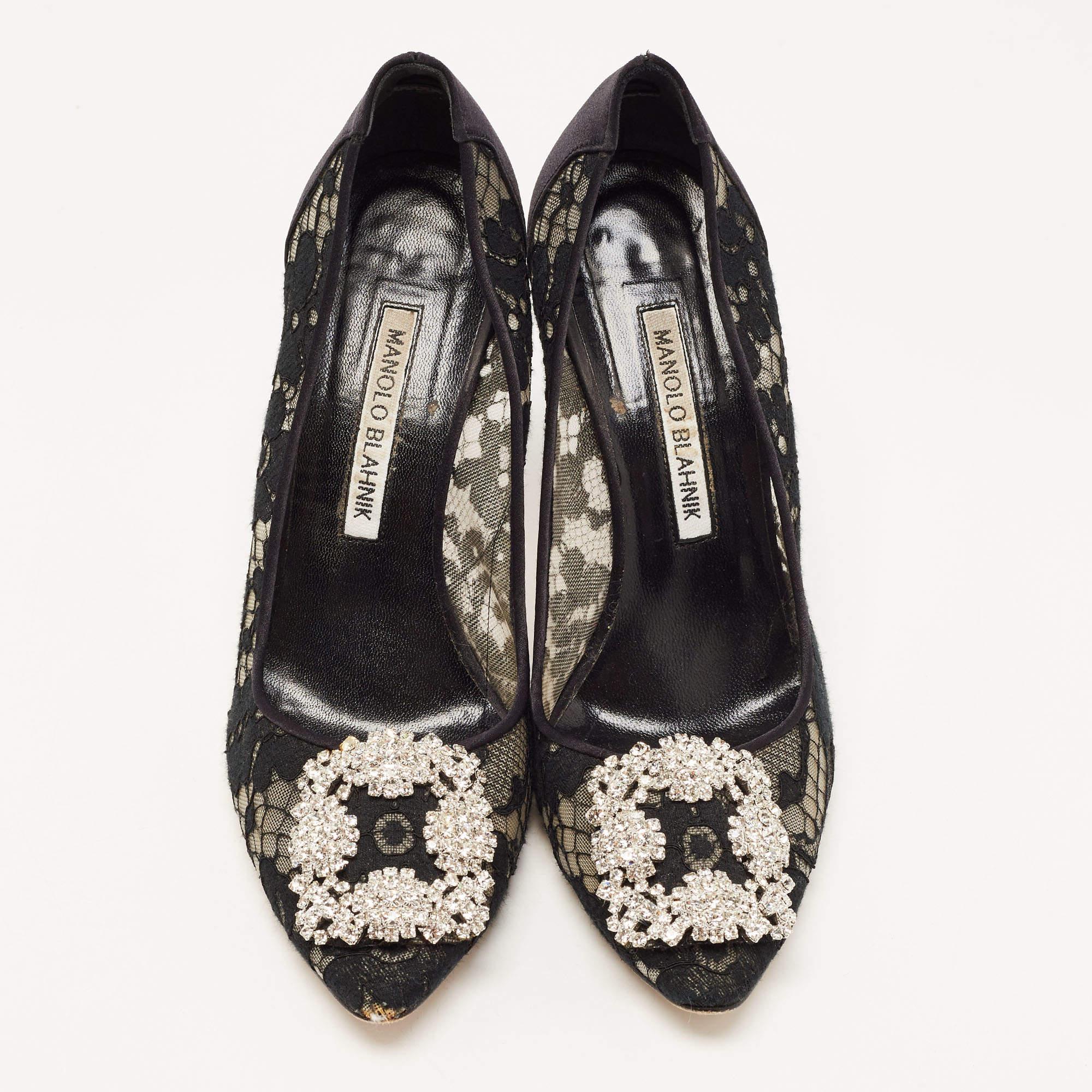 The 9.5cm heels of this pair of Manolo Blahnik pumps will reflect grace and luxury in every step. Made from satin and lace, it is made striking with crystal-embellished buckle detailing on the toes and exhibits branded insoles.

Includes: Original