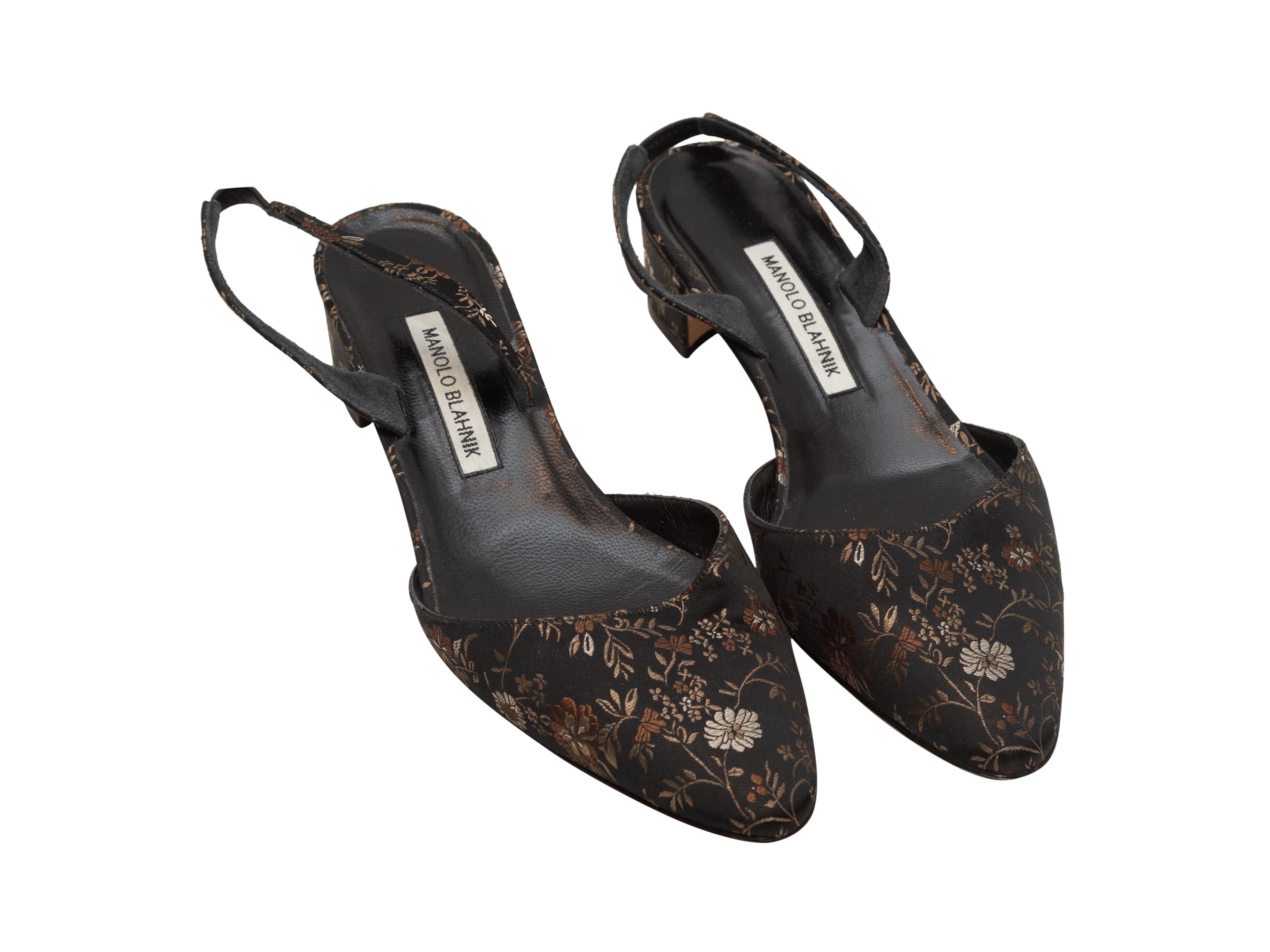 Product details: Black, brown, and tan jacquard slingback heels by Manolo Blahnik. Floral pattern throughout. Block heels. Designer size 40. 1.5