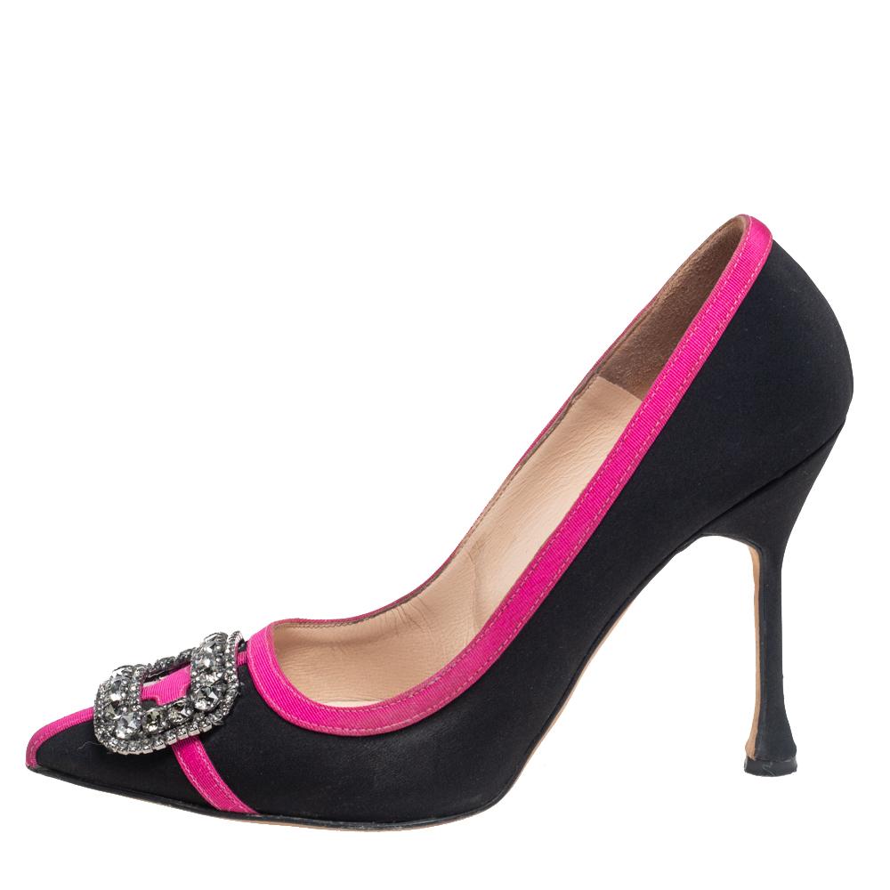 Manolo Blahnik is well-known for its graceful designs that represent femininity and elegance flawlessly. These Okkava pumps are crafted using black-pink satin and flaunt pointed toes that are augmented by beautiful crystal embellishments. They are