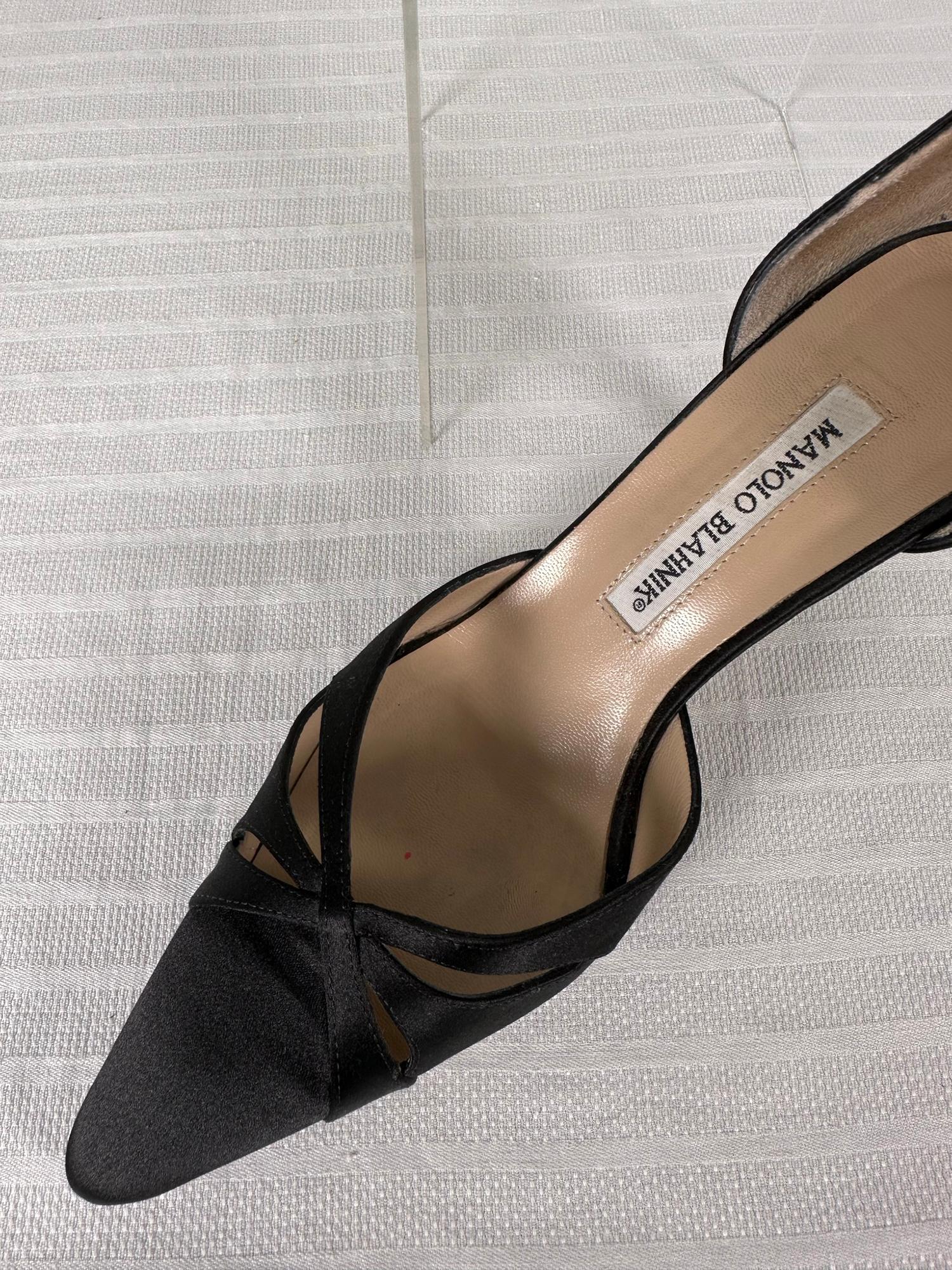 Manolo Blahnik black satin butterfly D' Orsay high heel pumps marked size 7 1/2. Beautiful shoes leather lined with leather soles. Open work satin design at the fronts look like butterfly wings. Previously owned & well cared for, comes with