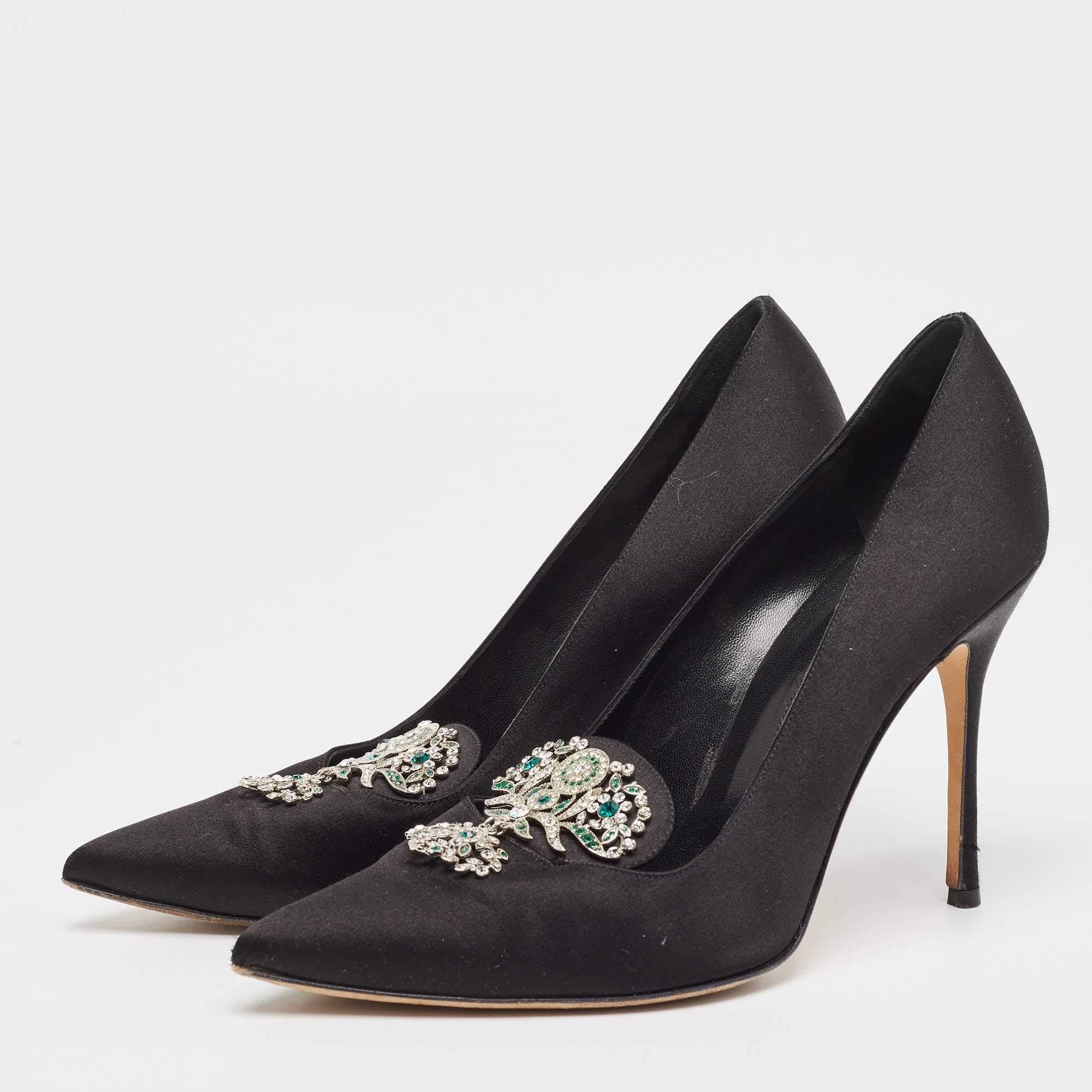 These pumps from Manolo Blahnik are truly chic and beautiful. They are designed using black satin with intricate crystal embellishments attached to their vamps. They have heels measuring 10.5cm which gives them a classy aspect. Revamp your outfit by