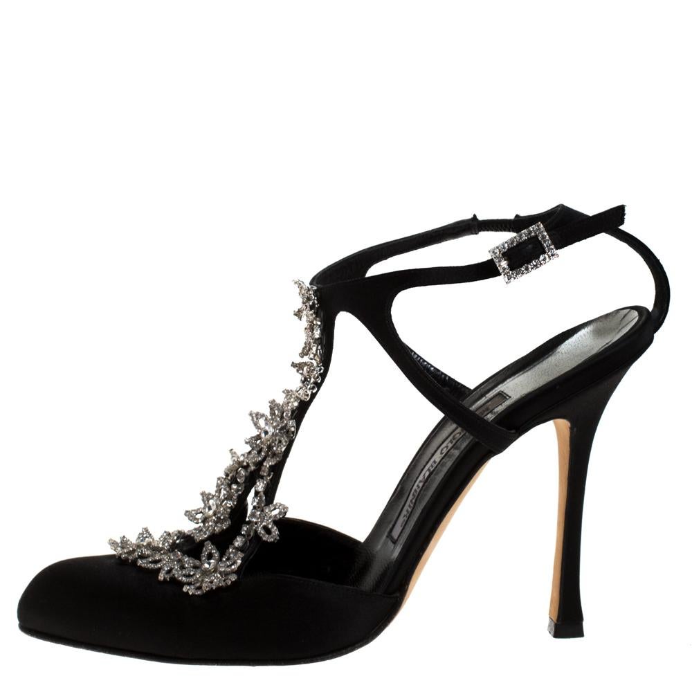 These glamorous sandals come from the house of Manolo Blahnik. Crafted meticulously in Italy and made from quality satin, these luxurious sandals carry a classic shade of black. they are designed to add sophistication and class to any outfit. They