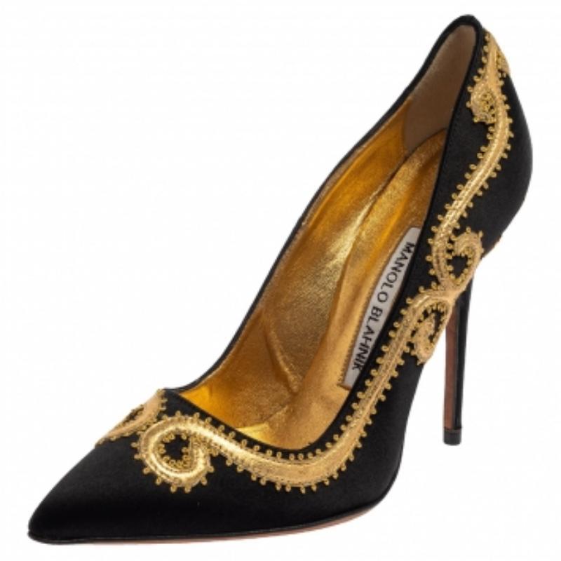 Exquisite and ethereal, these Manolo Blahnik pumps are all you need to make heads turn and win admiring glances! The black pumps have been crafted from plush satin and styled with pointed toes and intricate embroidery on the exterior. They are