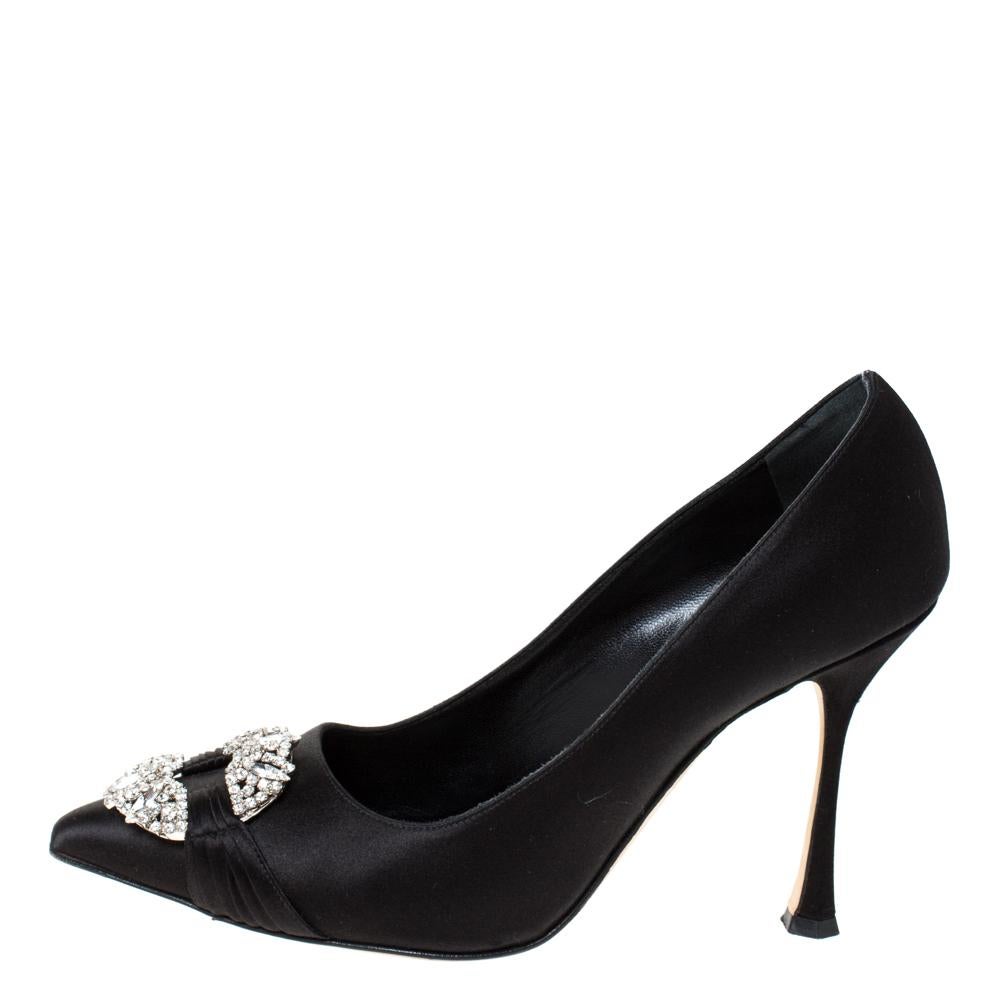 A subtle combination of beauty and craftsmanship, Manolo Blahnik's designs are highly admirable. Crafted in black satin, these pumps feature pointed toes, 10.5 cm heels and crystal detailing on the uppers.

Includes:Original Box, Info Booklet
