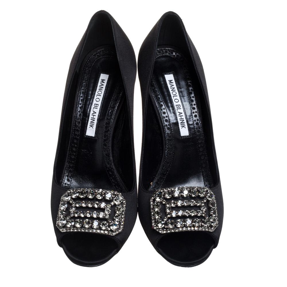 Manolo Blahnik presents these lovely Matik pumps, a sleek and stunning option for a fashionista like you. A refined design, they feature eye-catching crystal embellishments on the uppers. Constructed from smooth satin in a black hue, these pumps are