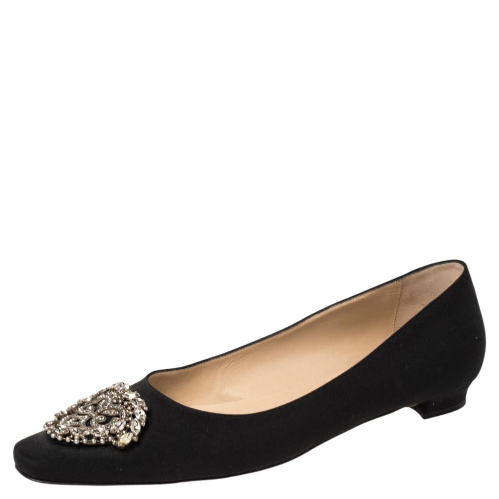 Manolo Blahnik is well-known for his graceful designs, and his label is synonymous with opulence, femininity, and elegance. These Okkato flats are crafted from satin in a black shade into an almond toe silhouette augmented by the embellishments