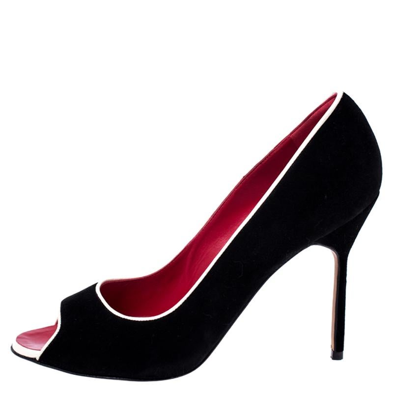 Pick this pair of Manolo Blahnik pumps to flaunt a simple yet stylish look. Fashion-forward and chic, these intricately designed pumps are made of suede. Revamp your collection of shoes by adding this pair of gorgeous black pumps.


