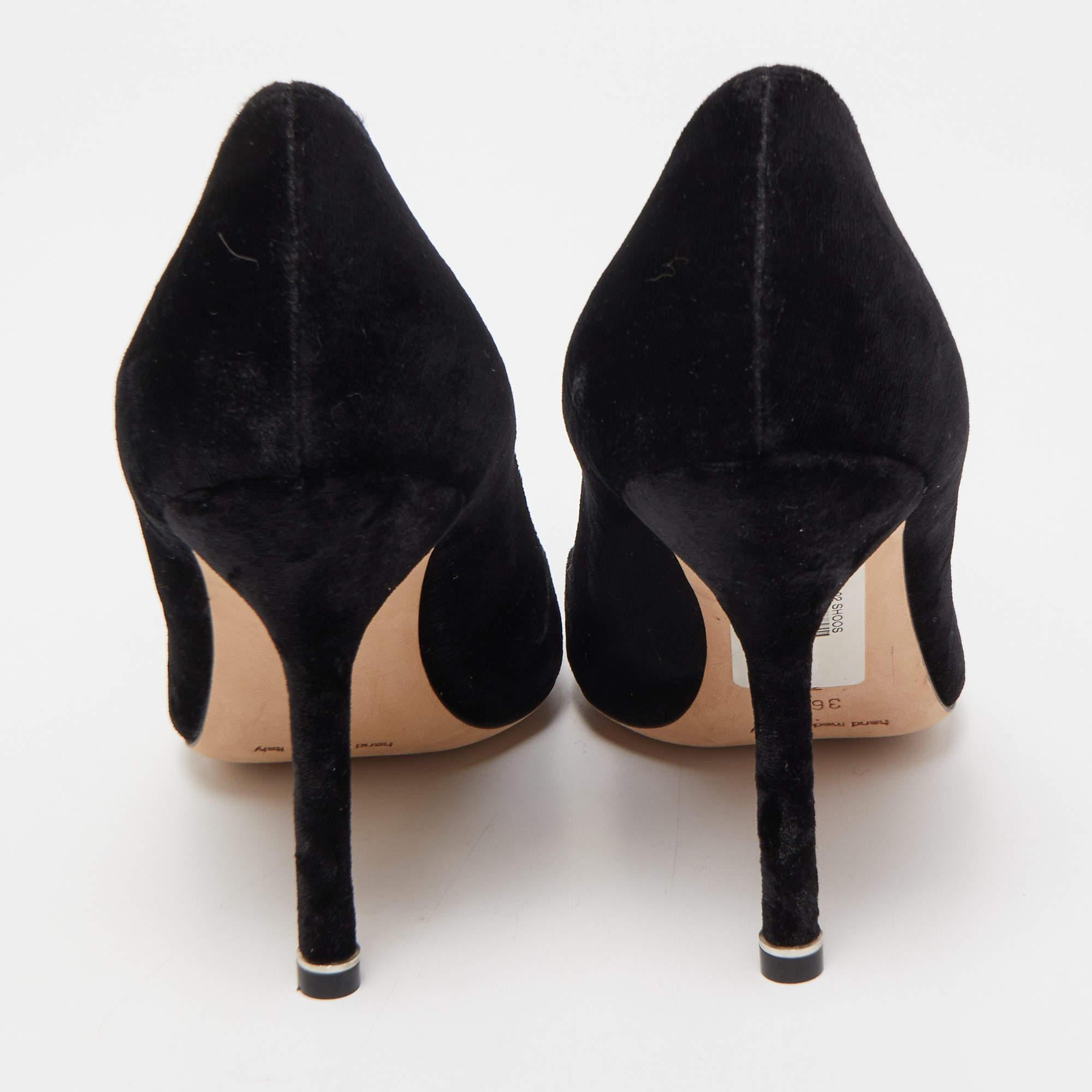 Manolo Blahnik is well-known for his graceful designs, and his label is synonymous with opulence, femininity, and elegance. These Hangisi pumps are shaped into a pointed-toe silhouette augmented by the embellishments perched on the uppers. They are