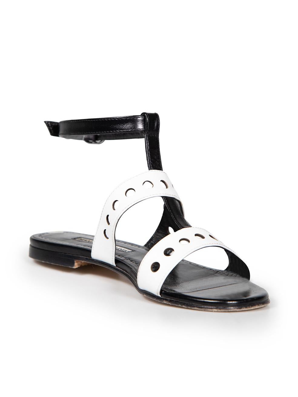 CONDITION is Very good. Minimal wear to sandals is evident. General creasing to the leather and wear on soles on this used Manolo Blahnik designer resale item.
 
 
 
 Details
 
 
 Black and white
 
 Leather
 
 Sandals
 
 Open toe
 
 Flat heel
 
