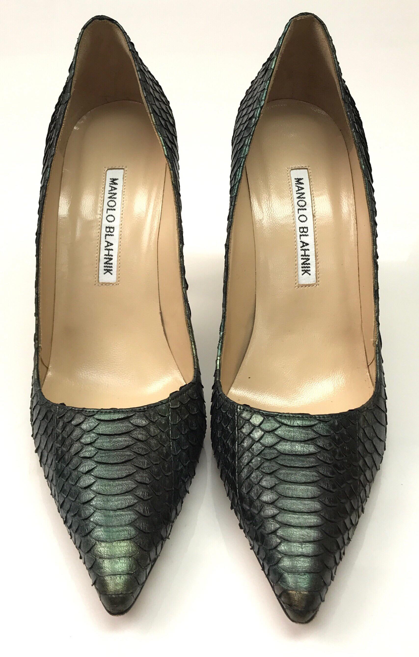 Manolo Blahnik Blue & Green Python Pumps - 38.5. These amazing Manolo Blahnik pumps are in excellent condition. They show barely any sign of use, with exception to the bottom of the shoe, as shown in picture. They are a blue and green python print