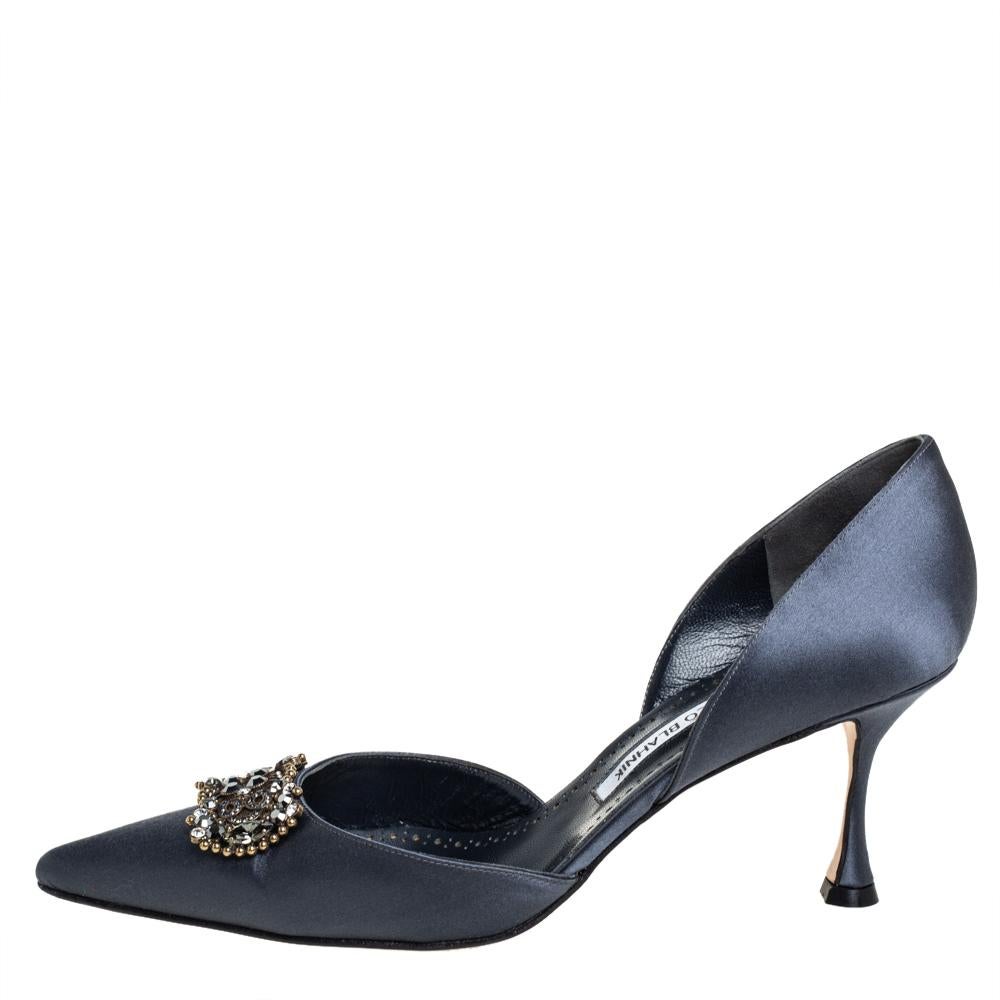 Manolo Blahnik is well-known for his graceful designs, and his label is synonymous with opulence, femininity, and elegance. These D'orsay pumps are crafted from satin in a blue shade into a pointed toe silhouette augmented by the embellishments