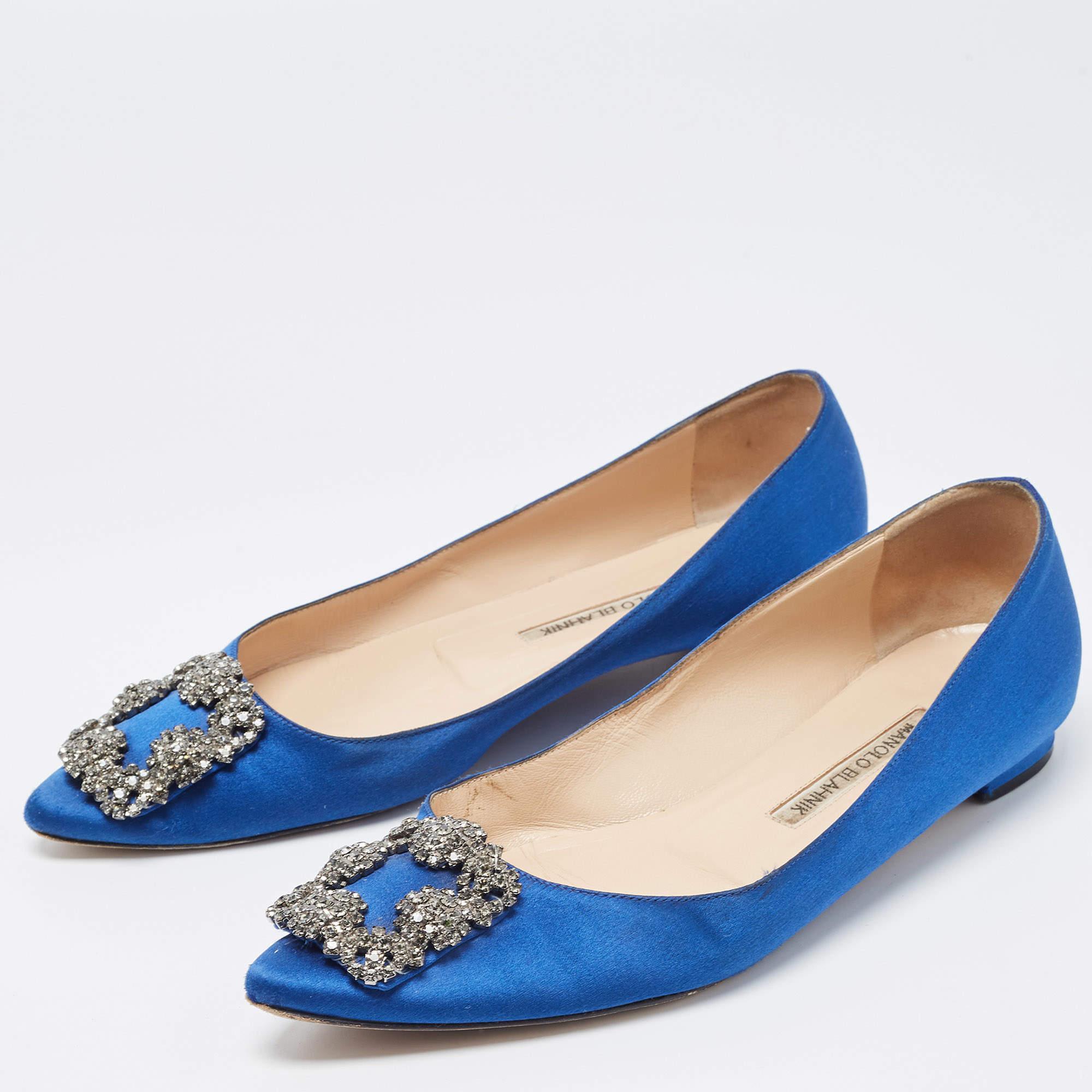 Chic and iconic, these ballet flats from Manolo Blahnik and perfect for a host of occasions. They have been crafted from blue satin and are styled with embellished toes.

