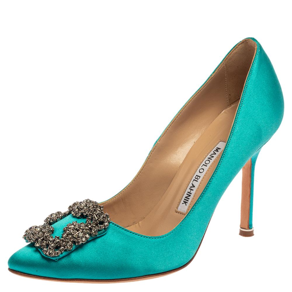 These iconic pumps are by Manolo Blahnik. Styled in blue satin with dazzling crystal embellishments on the toes and leather insoles to provide comfort, these luxurious pumps will never fail to lift your outfits. Complete with 9 cm heels, you can