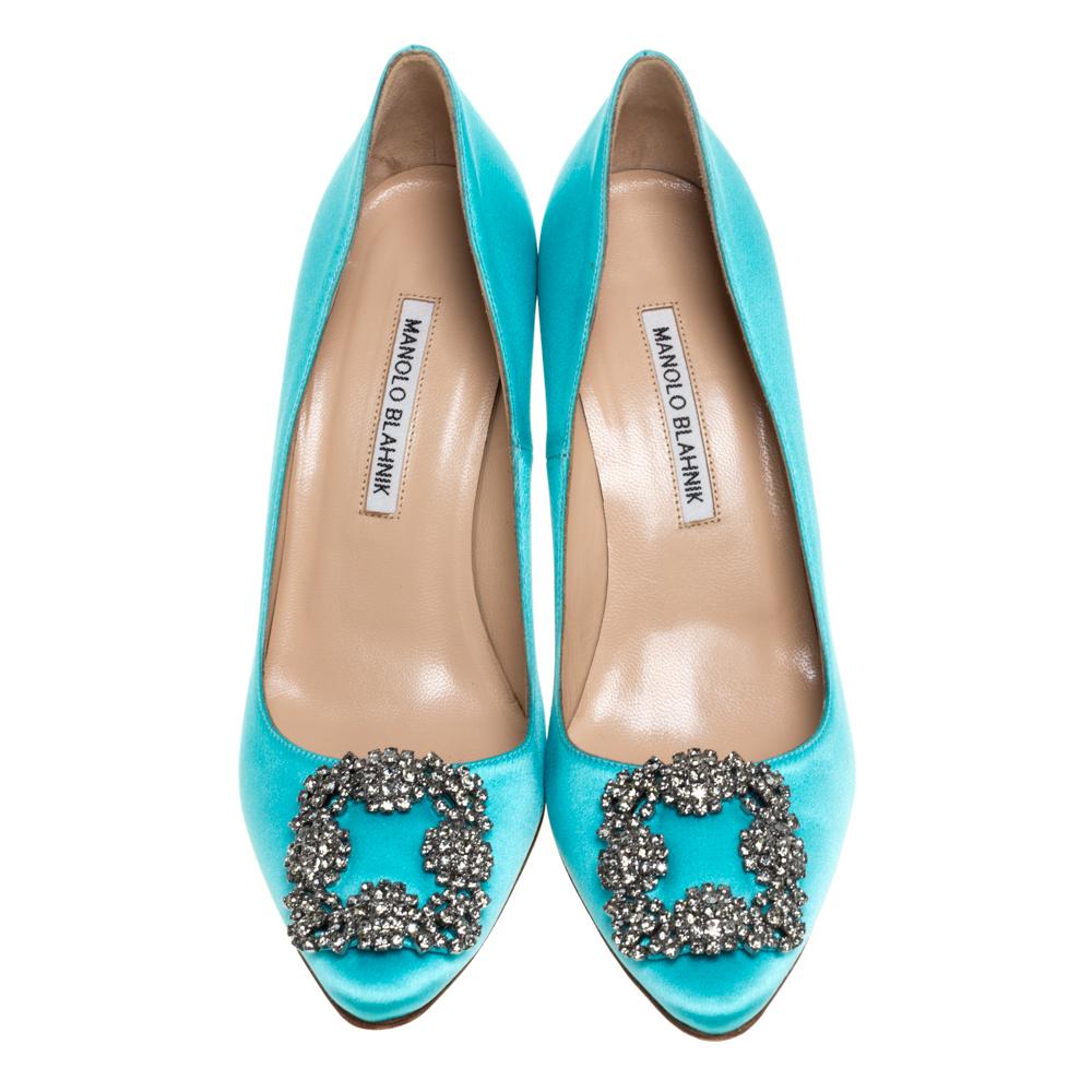These iconic pumps are by Manolo Blahnik. Styled in blue satin with dazzling embellishments on the toes, and leather insoles to provide comfort, these luxurious pumps will never fail to lift your outfits. Complete with 9.5 cm heels, you can wear