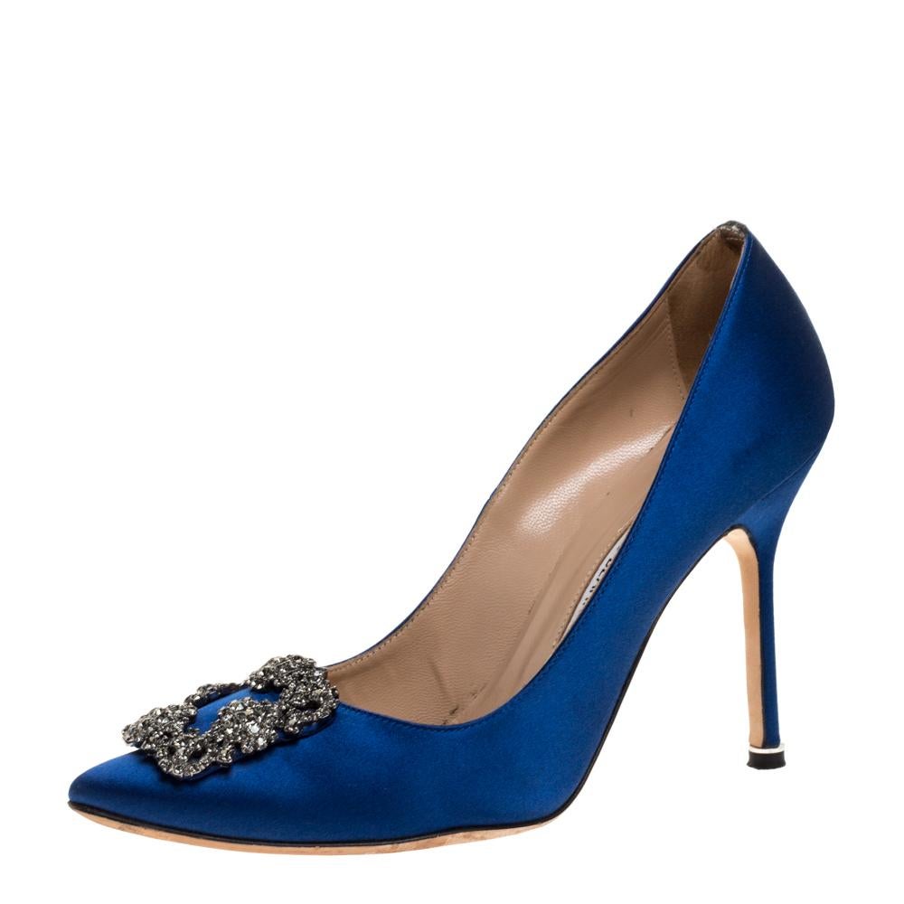 These iconic pumps are by Manolo Blahnik. Styled in a blue hue, with dazzling embellishments on the toes, and leather insoles to provide comfort, these luxurious satin pumps will never fail to lift your outfits. Complete with 10.5 cm heels, you can