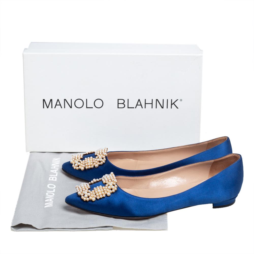 Manolo Blahnik is well-known for his graceful designs, and his label is synonymous with opulence, femininity, and elegance. These Hangisi ballet flats are crafted from satin into a pointed toe silhouette augmented by the pearl embellishments perched
