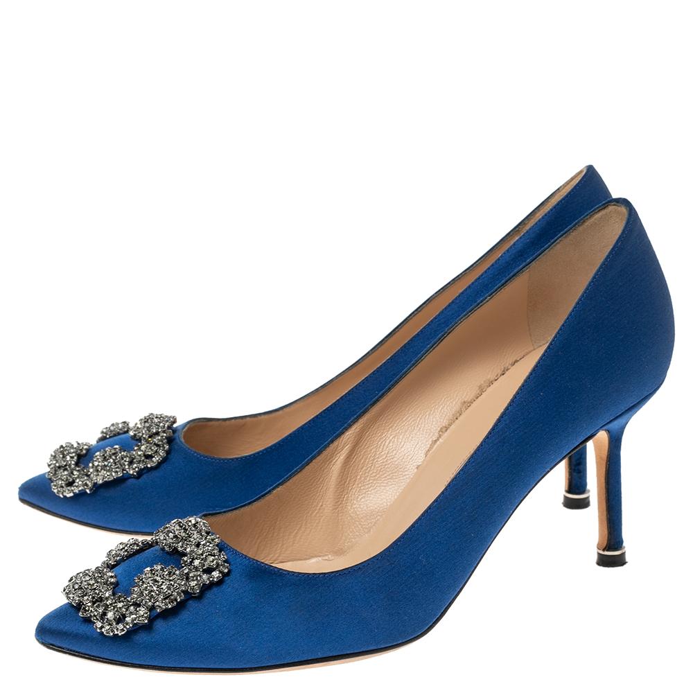 Manolo Blahnik is well-known for his graceful designs, and his label is synonymous with opulence, femininity, and elegance. These Hangisi pumps are crafted from satin into a pointed toe silhouette augmented by the embellishments perched on the