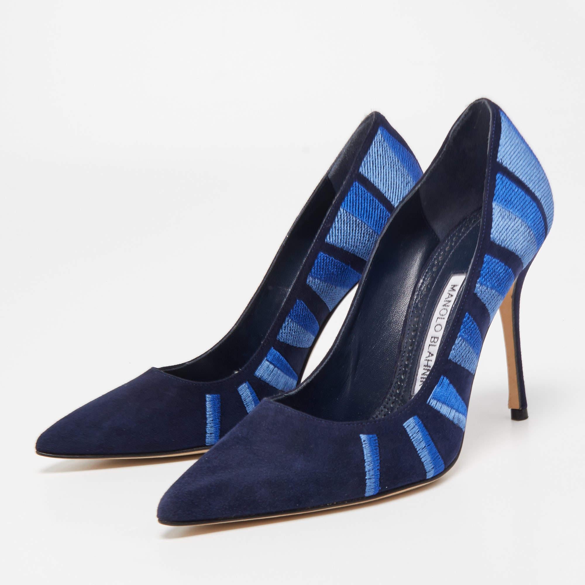 The Manolo Blahnik BB pumps are exquisite footwear crafted with luxurious blue suede and adorned with intricate embroidery. These pumps feature a classic pointed toe and a stiletto heel, combining elegance and style to create a timeless and