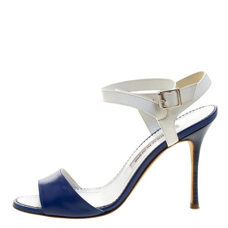 You know you're going to have a blissful day the moment you put these sandals on. They are a Manolo Blahnik creation, meticulously crafted from leather. The pair comes designed to perfection with blue front straps, white ankle straps, and 9.5 cm