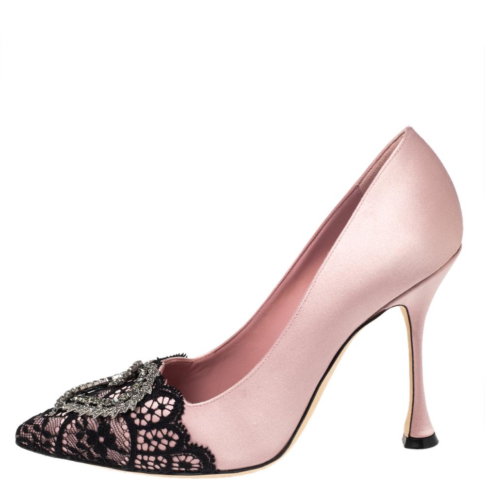 Manolo Blahnik is well-known for his graceful designs, and his label is synonymous with opulence, femininity, and elegance. Crafted from blush pink satin, the pointed-toes are highlighted with panels of intricate lace in black.

Includes: Original