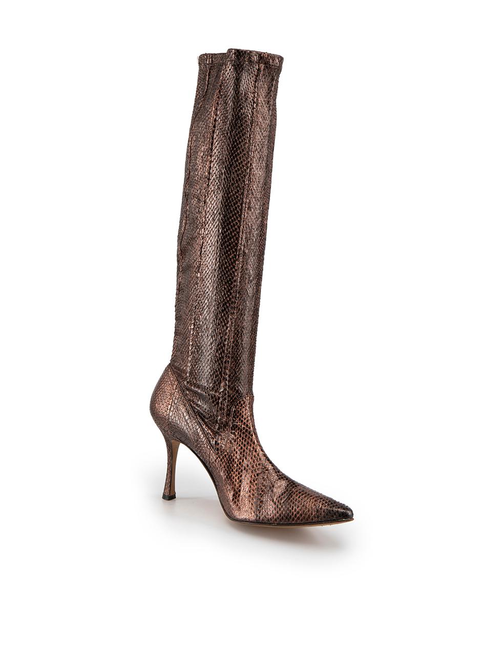 CONDITION is Very good. Minimal wear to boots is evident. Minimal wear to the texture with drying of the snakeskin on this used Manolo Blahnik designer resale item.

Details 
Brown metallic
Snakeskin
Knee high boots
Point toe
Slip on
High