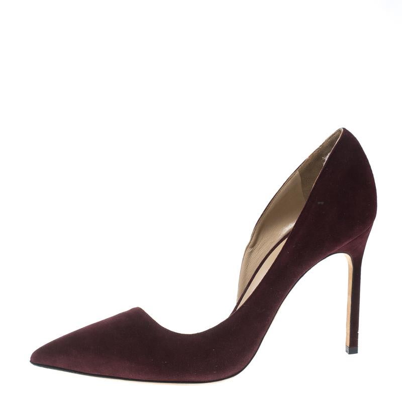Crafted from suede in a D'orsay style with pointed toes, these Manolo Blahnik pumps come ready to give you a high-fashion experience. The rich brown pumps, with sharp-cut toplines, are balanced on 10.5 cm heels and finished with comfortable insoles.