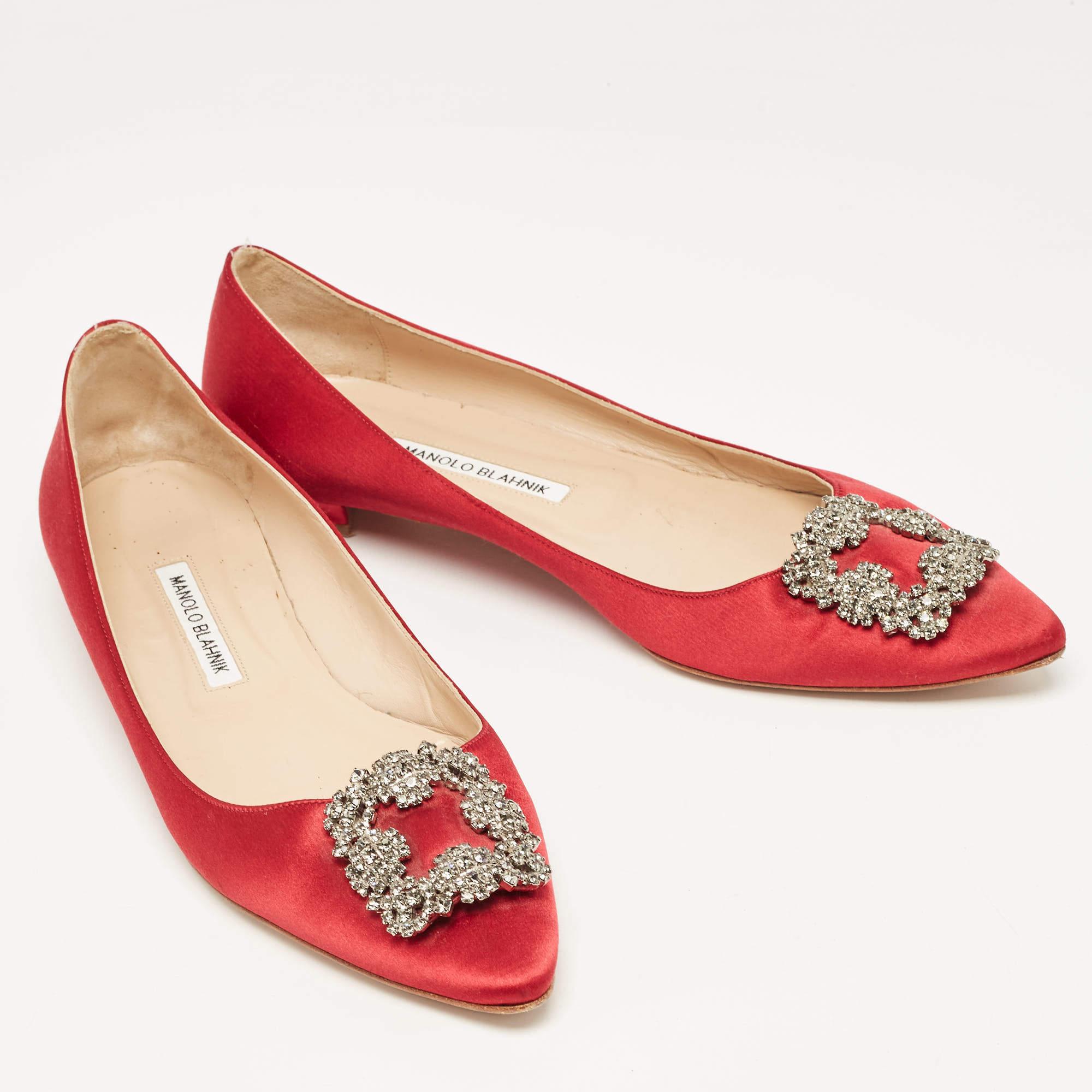 These iconic ballet flats are by Manolo Blahnik. Styled in a burgundy hue, with dazzling embellishments on the toes and leather insoles to provide comfort, these luxurious satin pumps will never fail to lift your outfits.

