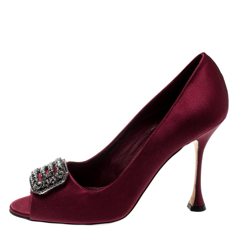 You know you're going to have a glamorous day the moment you put these pumps on. They are a Manolo Blahnik creation, meticulously crafted from satin and lined with leather. The burgundy pair features peep toes, 10.5 cm heels and crystals decorated