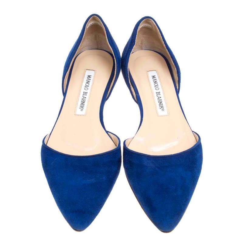 Fashion is the perfect blend of luxury with comfort, and this pair of flats from the house of Manolo Blahnik exudes just that. Crafted from cobalt blue suede and styled in a D'Orsay silhouette with pointed toes and low heels, these flats are ideal
