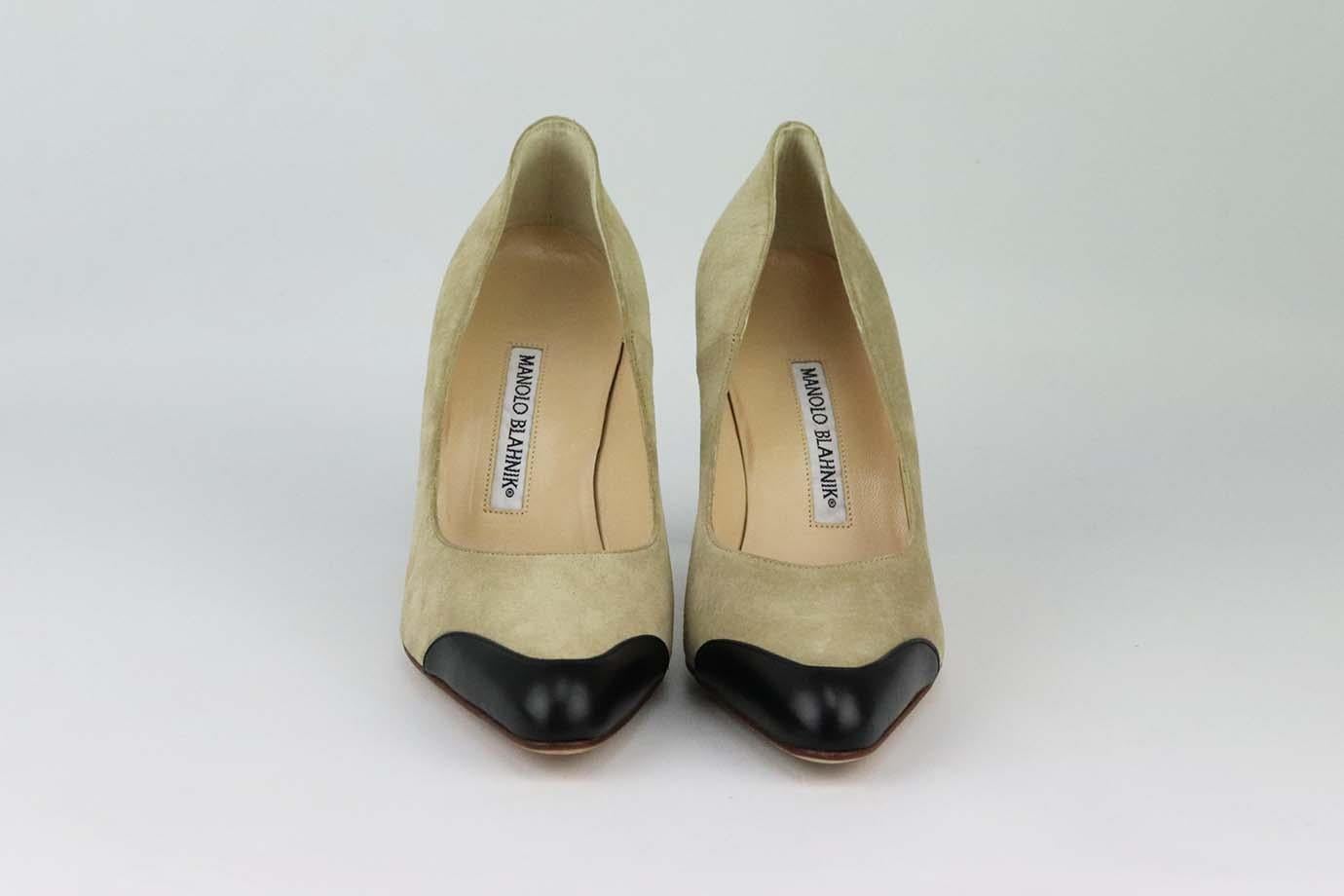 These pumps by Manolo Blahnik are a classic style that will never date, made in Italy from supple beige suede and black leather, they have rounded toes and comfortable 89 mm heels to take you from morning meetings to dinner with friends. Heel