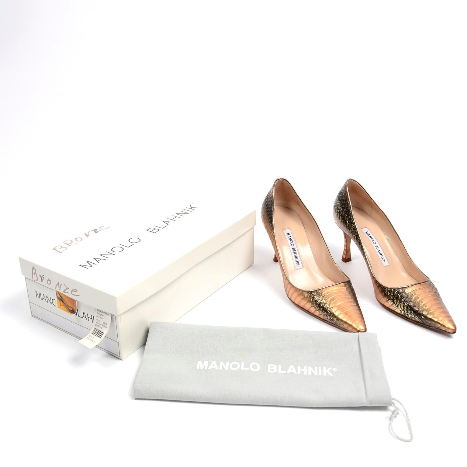 These are incredible Manolo Blahnik pumps in a copper / bronze snakeskin. The style name is Newcio and the color is Rose Bronze. These shoes were originally purchased at the high end boutique Mario's in Portland, Oregon, and they come with their