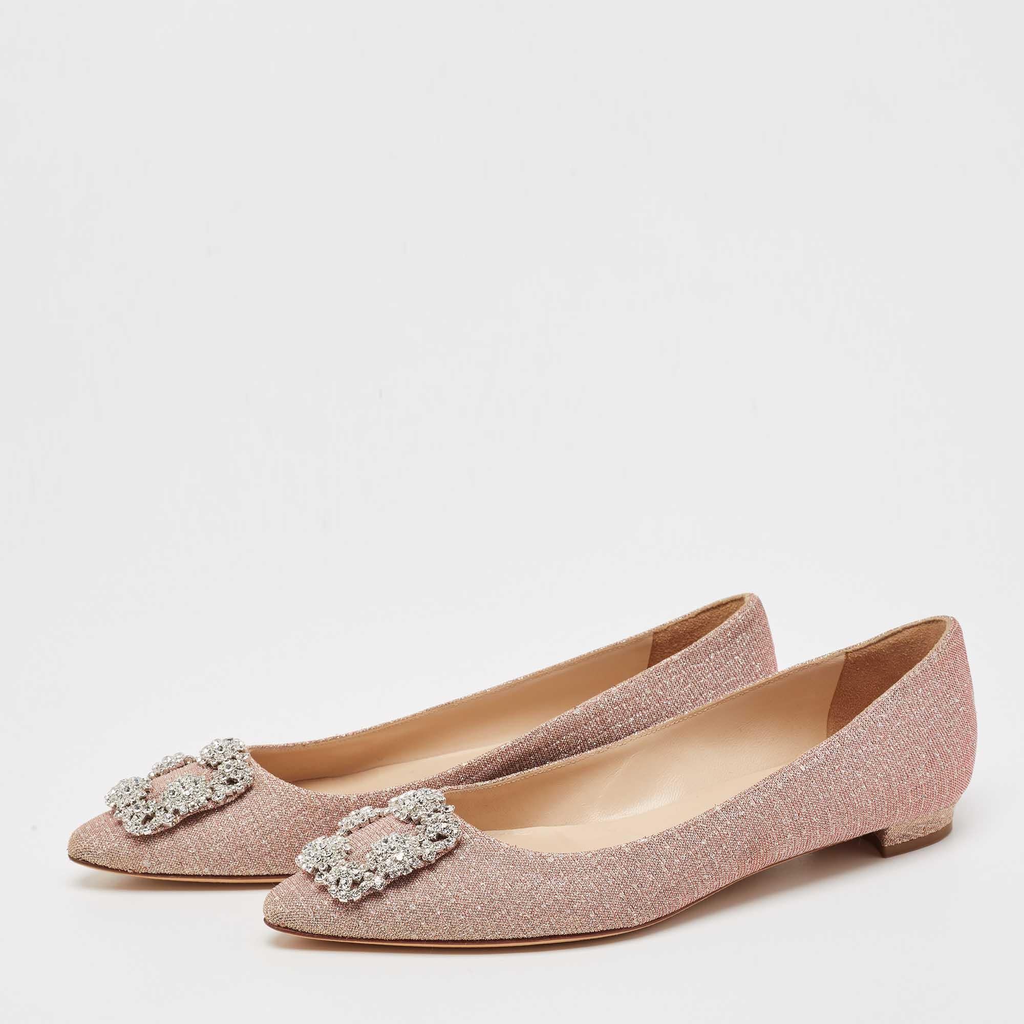 You know you are going to have a glamorous day the moment you put these ballet flats on. They are a Manolo Blahnik creation, meticulously crafted from glitter and lined with leather on the insoles. The pair carries a classic gold hue and