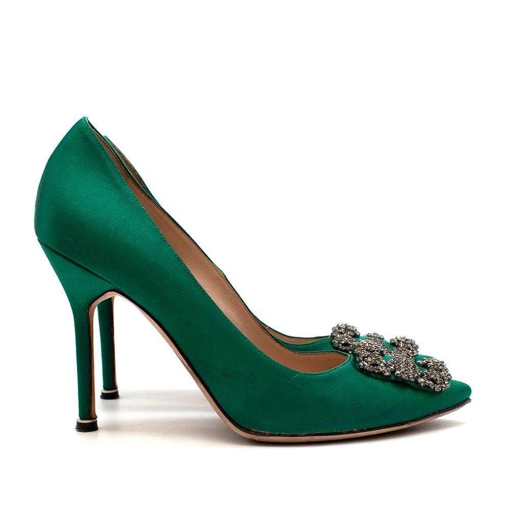 Manolo Blahnik Green Hangisi Satin Jewel Buckle Pumps

Iconic green satin almond toe pumps featuring a square crystal buckle and a stiletto high heel. 

Materials:

Upper: 68% viscose, 32% silk. 
Sole: 100% cow leather. 
Lining: 100% kid leather.