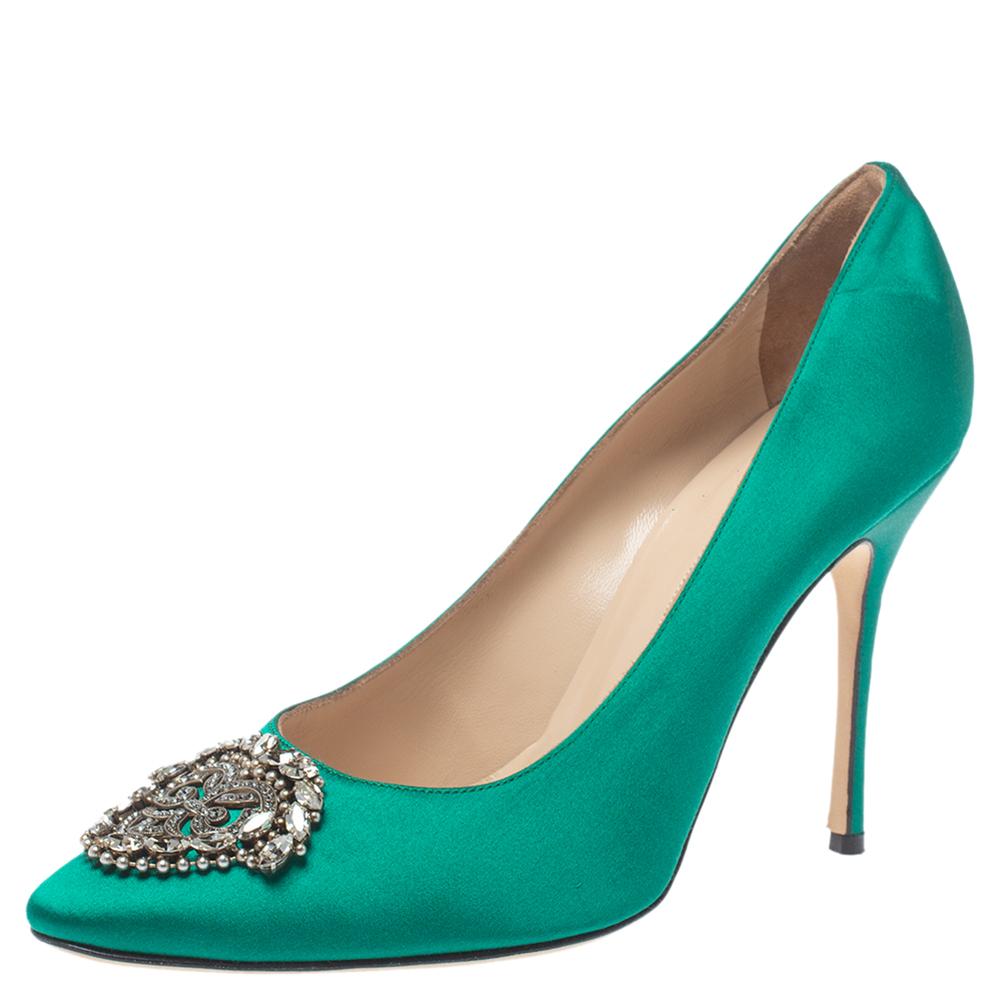 You know you are going to have a glamorous day the moment you put these pumps on. They are a Manolo Blahnik creation, meticulously crafted from satin and lined with leather on the insoles. The pair carries a classic green hue and embellishments on