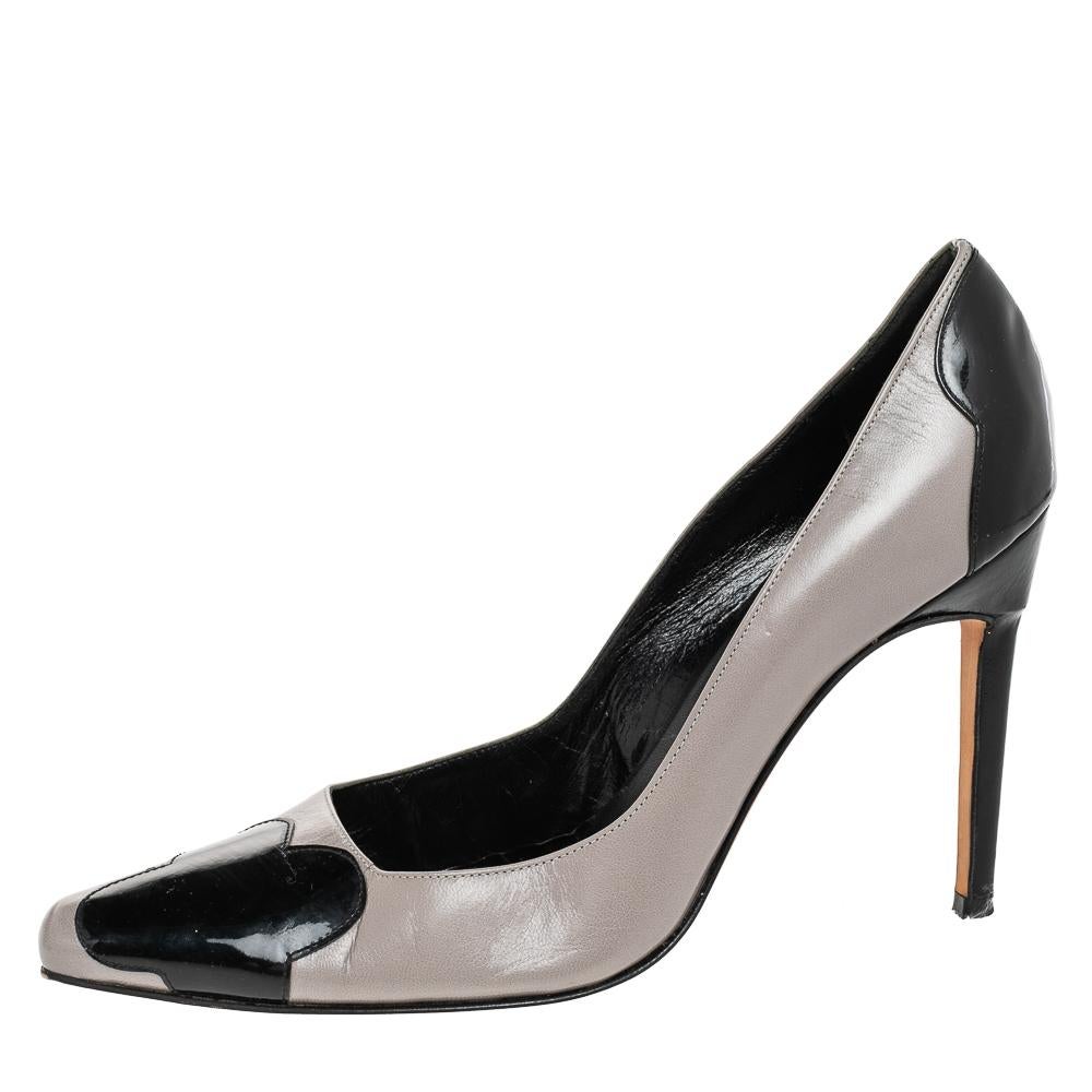 These contemporary Adra pumps by Manolo Blahnik will finish off any outfit with ultra-chic style. Crafted in leather and patent leather, these two-tone pumps are leather lined and feature cropped pointed toes. Blahnik's style is celebrated around