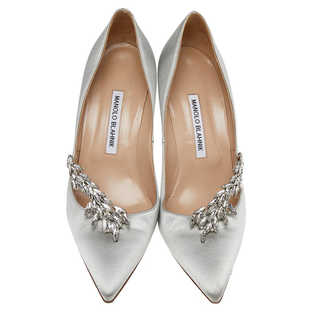 Manolo Blahnik is well-known for his graceful designs, and his label is synonymous with opulence, femininity, and elegance. These Nadira pumps are crafted from satin into a pointed toe silhouette augmented by the embellishments perched on the