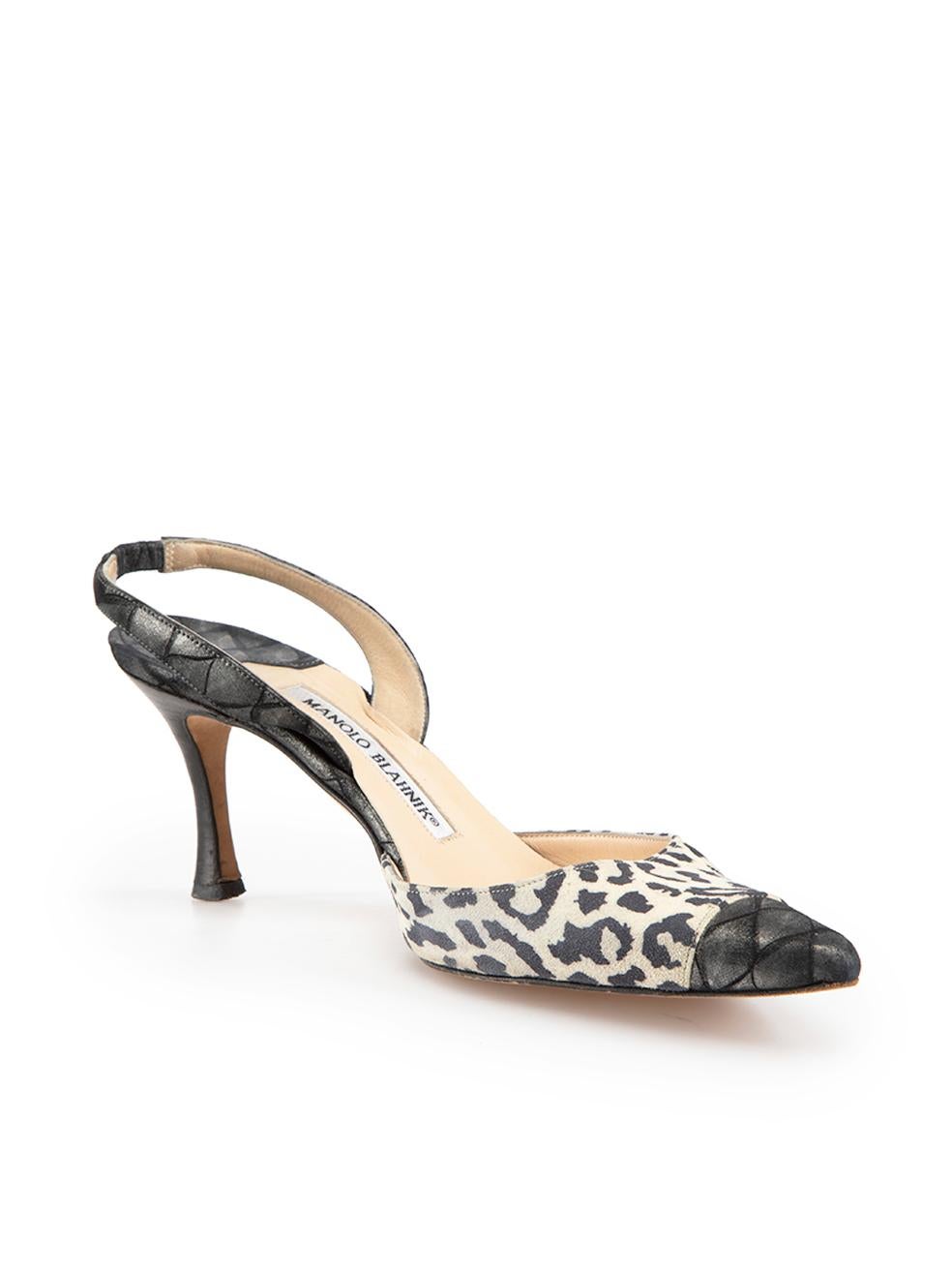 CONDITION is Good. Minor wear to shoes is evident. Light wear to both toe tips and heels with abrasions to the wood and satin on this used Manolo Blahnik designer resale item.

Details
Grey - metallic finish
Suede
Heels
Cream and black leopard print