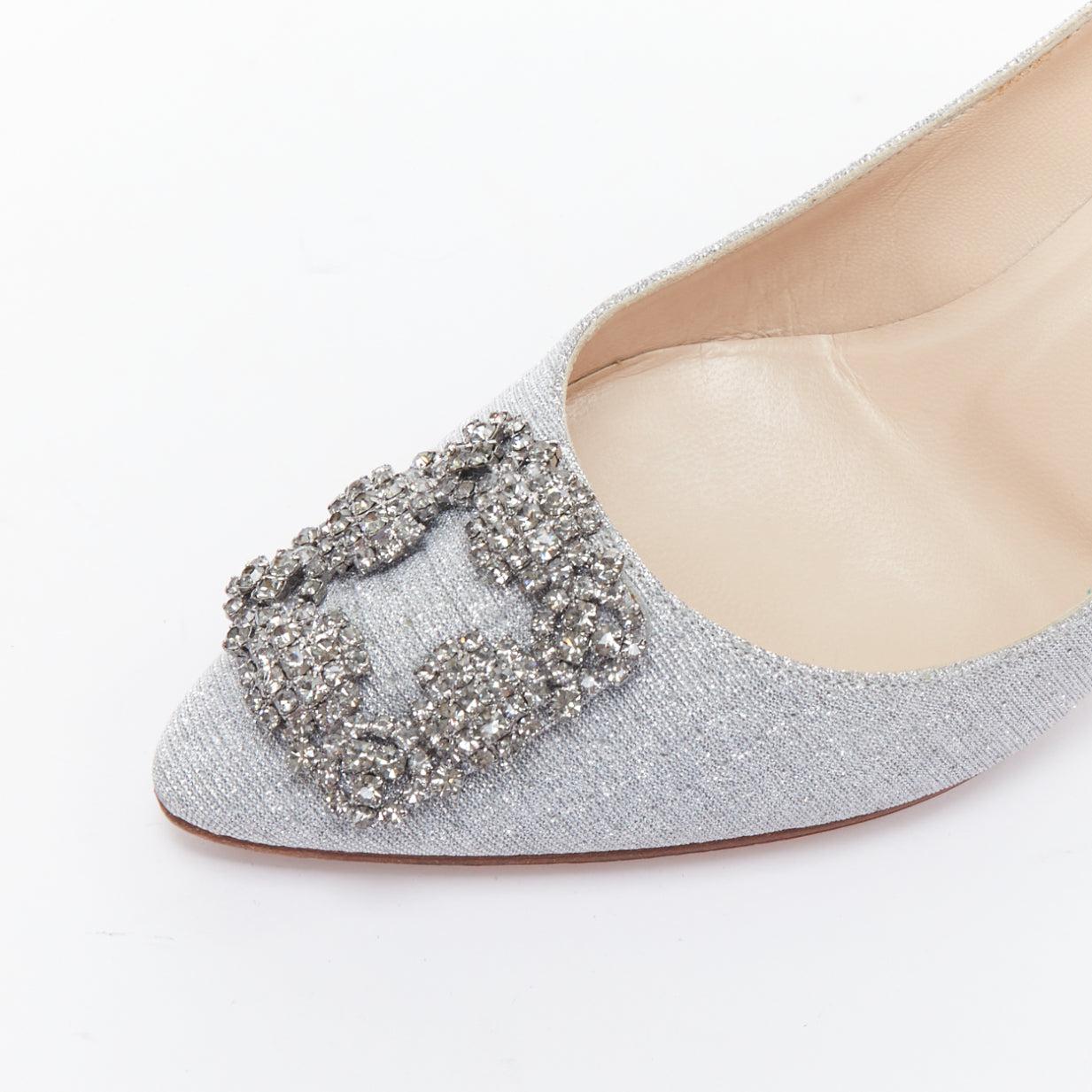 MANOLO BLAHNIK Hangisi 60 silver fabric crystal buckle pumps EU39
Reference: JHDN/A00038
Brand: Manolo Blahnik
Model: Hangisi 60
Material: Fabric
Color: Silver
Pattern: Solid
Closure: Slip On
Lining: Nude Leather
Extra Details: Silver crystal