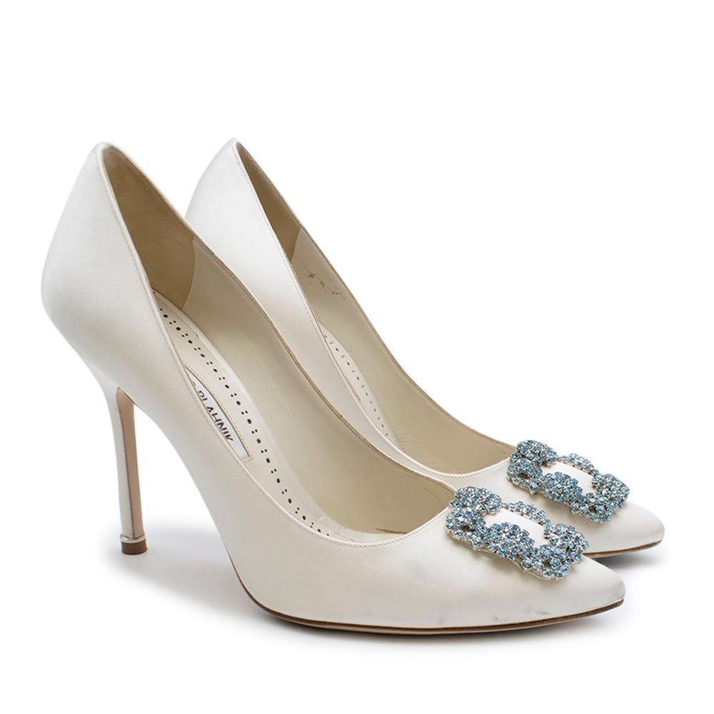 white coloured Manolo Blahnik 10cm pump.Featuring a  stiletto heel, a silk lining, a branded insole, a silver-tone buckle detail to the front and an almond toe front shape.Hand made in Italy. RRP £875

Please note, these items are pre-owned and may