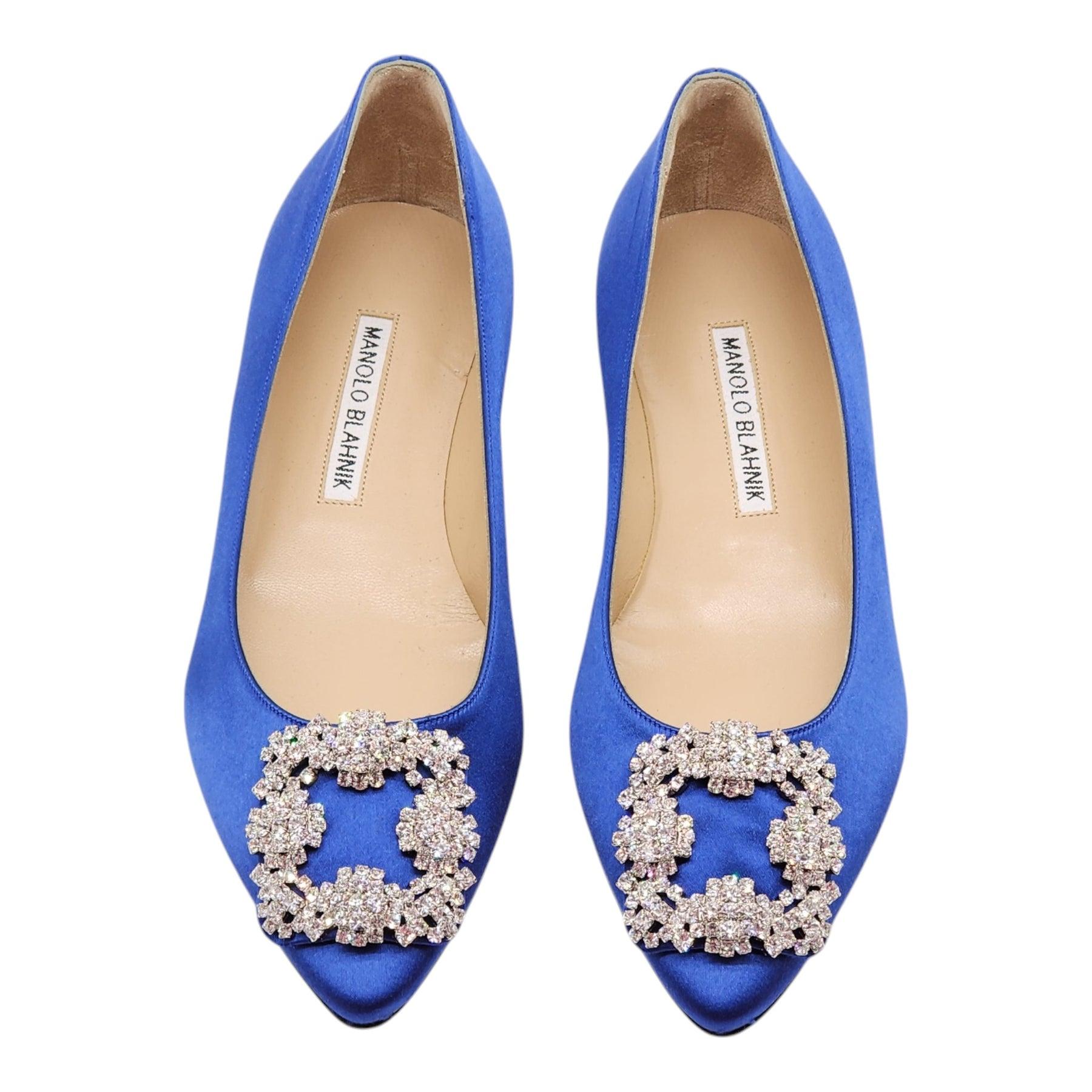 Blue satin almond toe flat pumps finished with a square crystal buckle encased in a gunmetal frame.

Notes from Blahnik: 