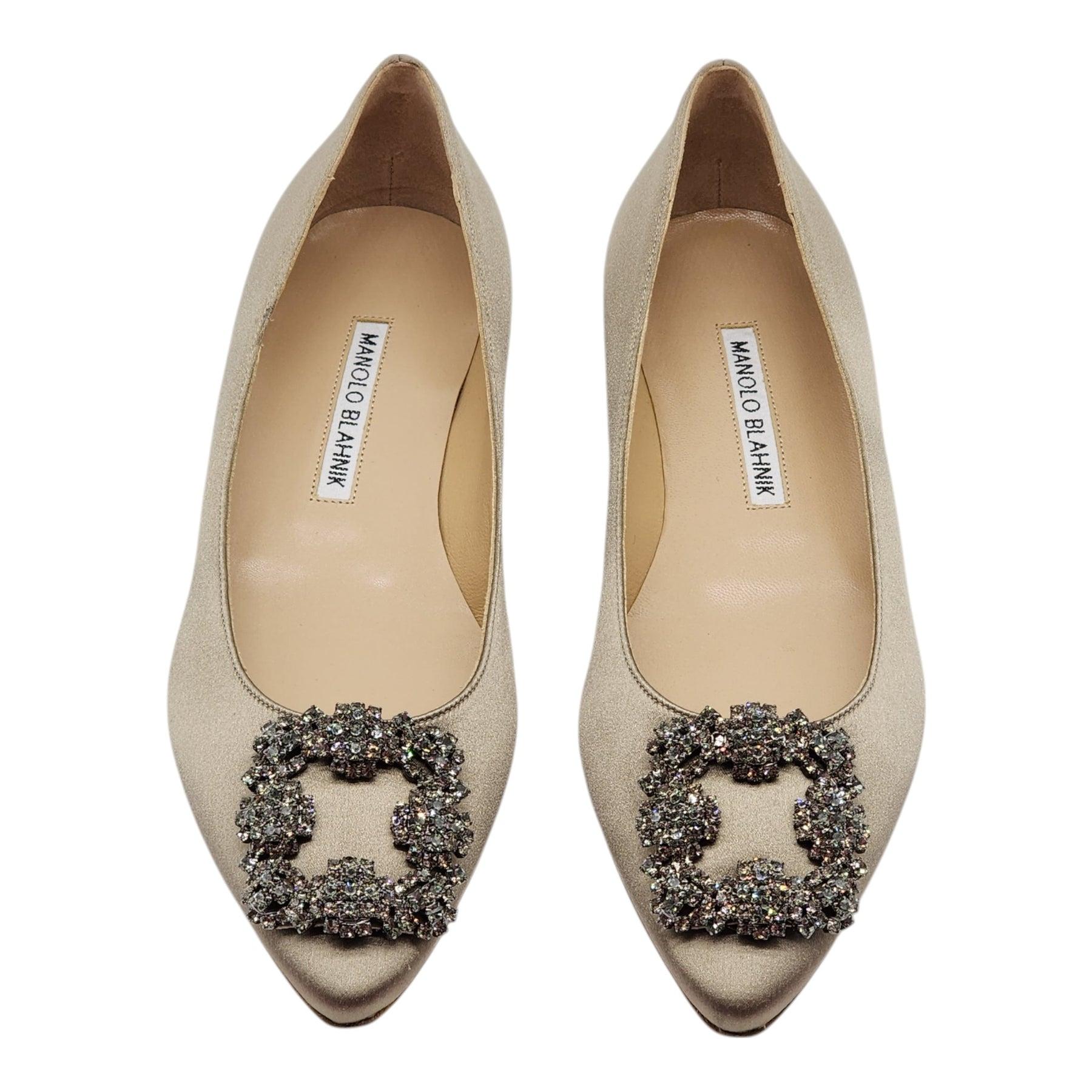Blue satin almond toe flat pumps finished with a square crystal buckle encased in a gunmetal frame.

Notes from Blahnik: 