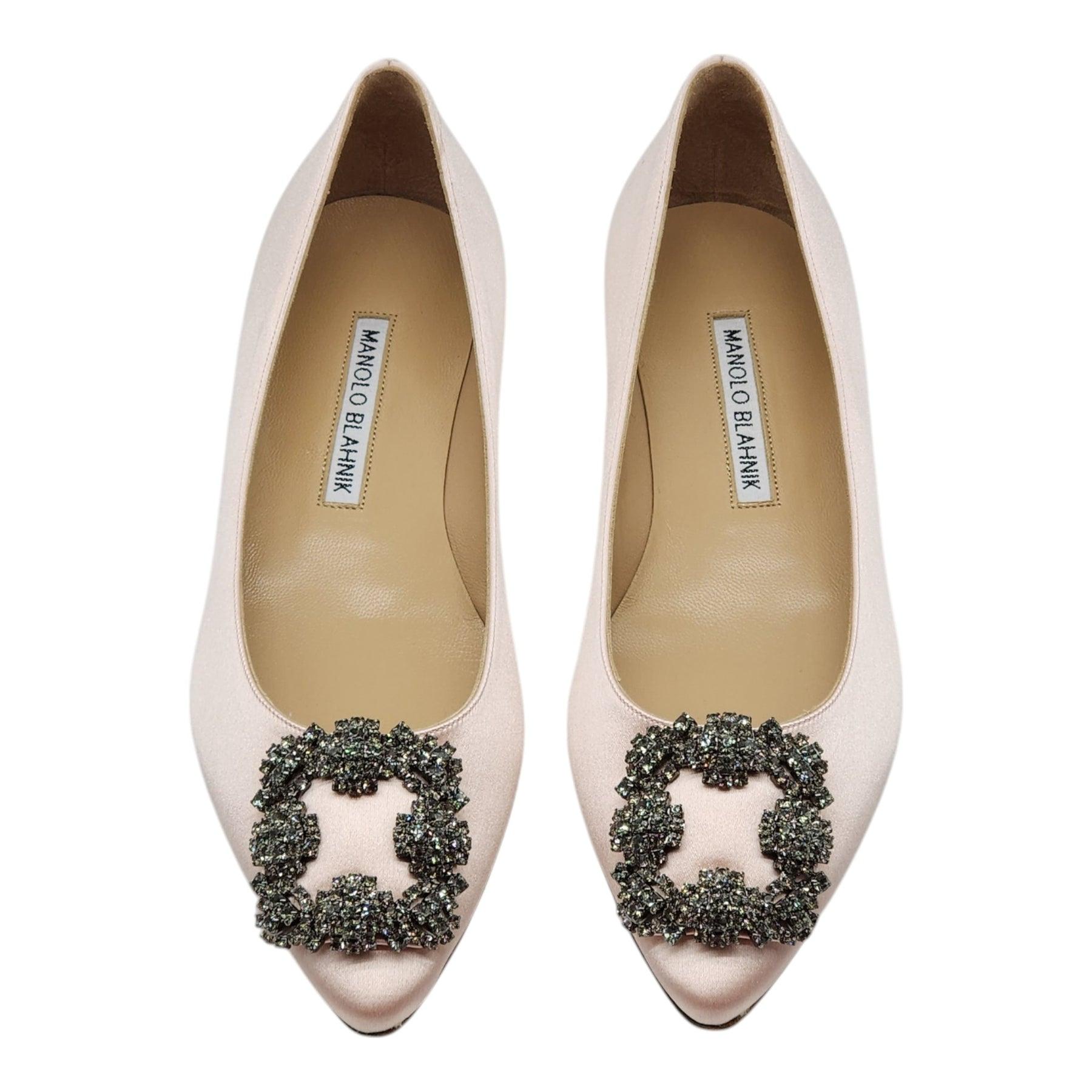 Blue satin almond toe flat pumps finished with a square crystal buckle encased in a gunmetal frame.

Notes from Blahnik: 