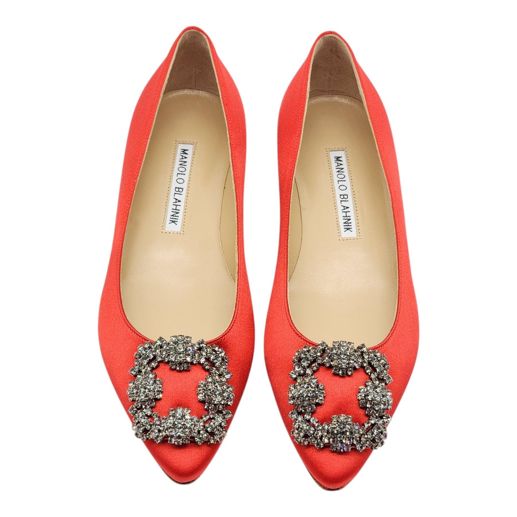 Blue satin almond toe flat pumps finished with a square crystal buckle encased in a gunmetal frame.

Notes from Blahnik: 