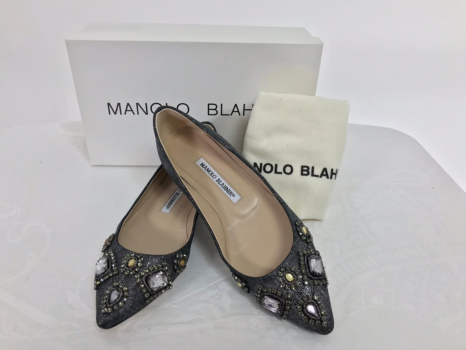 Manolo Blahnik Lanza jewel silver metallic fabric pointed toe ballet flats, barely worn, size 36 1/2. Silver metallic fabric with large sparkly jewels and beads. In excellent condition with the box and protector bag. 5/8 inch heel approximately.