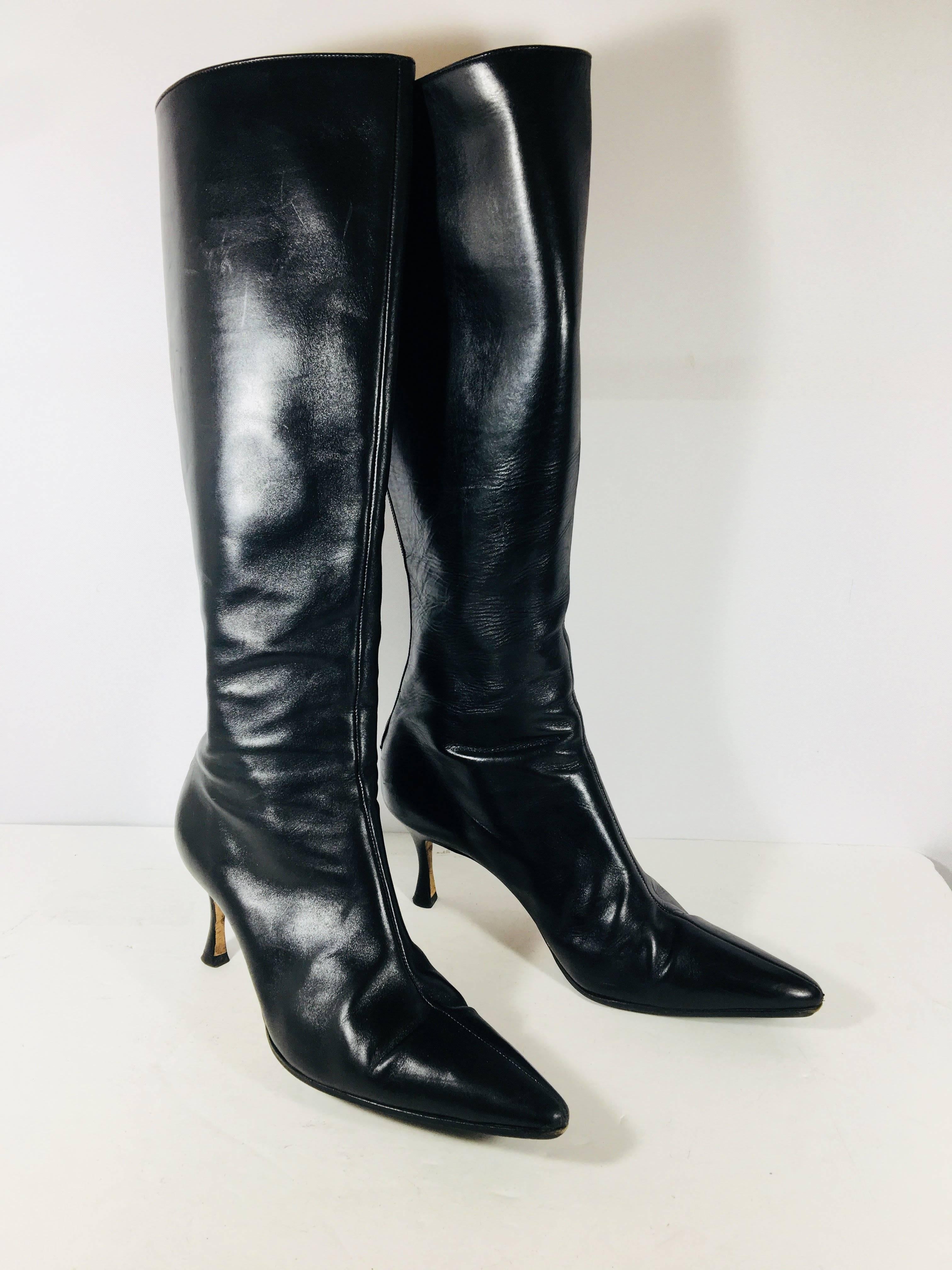 Manolo Blahnik Black Leather Knee High Boots with Pointed Toe, Zipper up Back, and Low Heel.