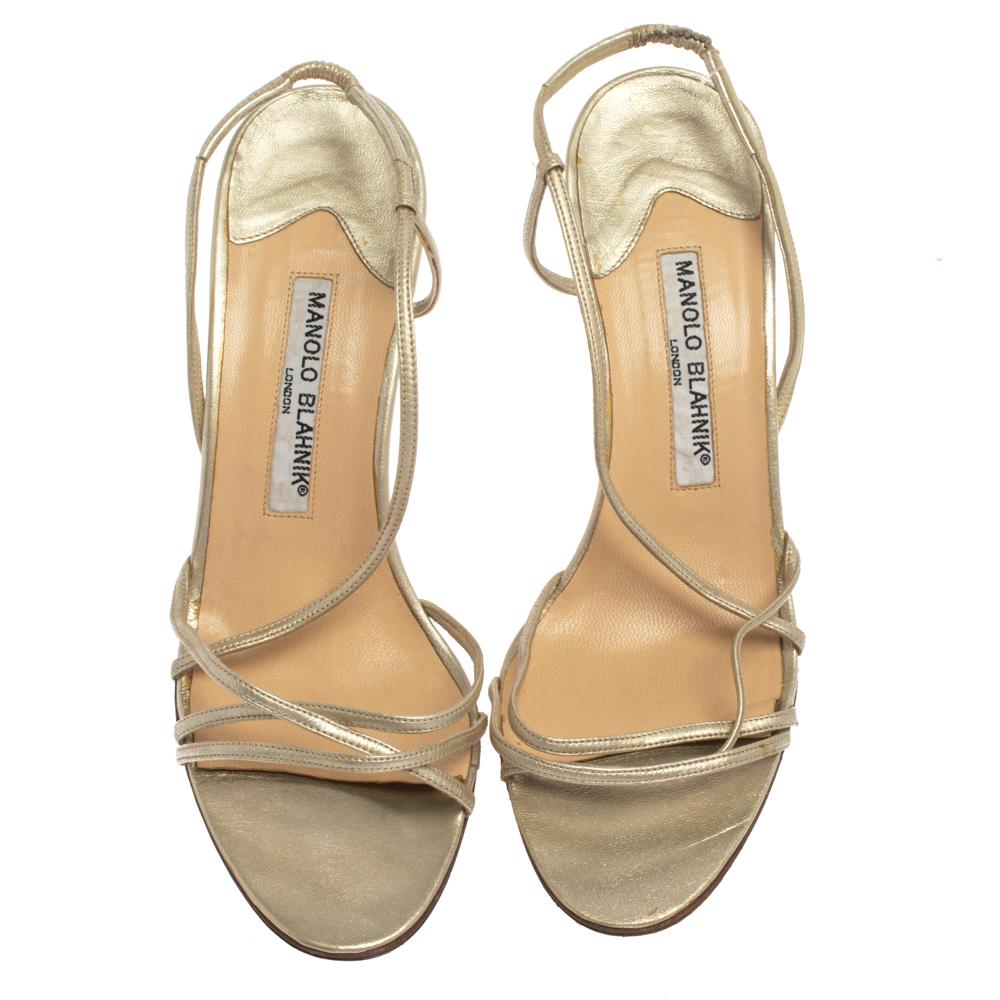 Chic, sophisticated, and stylish, these strappy sandals from Manolo Blahnik are perfect for adorning your feet. The light gold sandals are crafted from leather and feature an elegant silhouette. They flaunt a 10.5 cm heel, open toes, and come