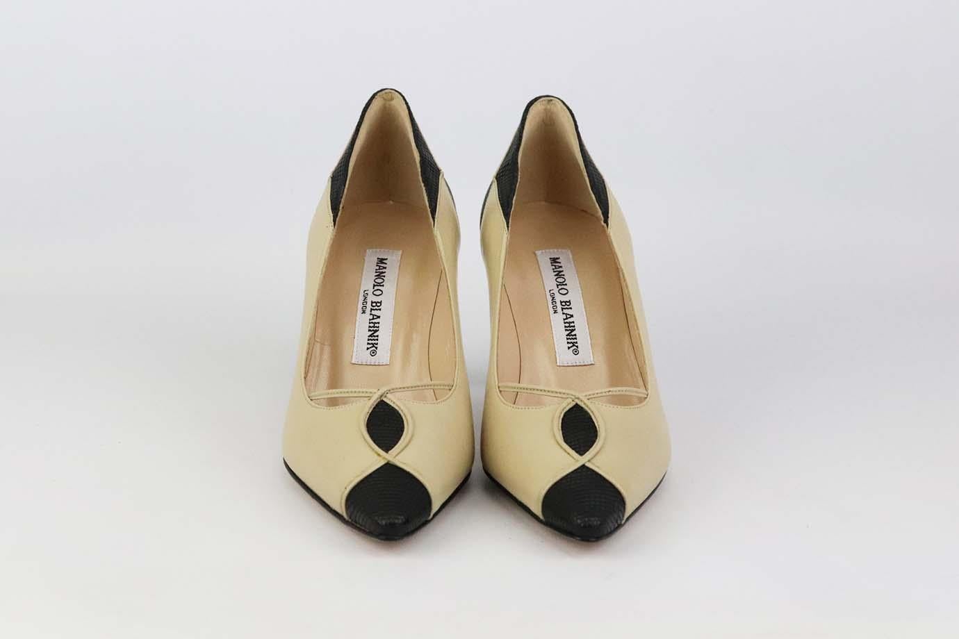These Vintage pumps by Manolo Blahnik are a classic style that will never date, made in Italy from supple black grosgrain and red suede, they have pointed toes, cutout detail at the side and comfortable 63 mm heels to take you from morning meetings